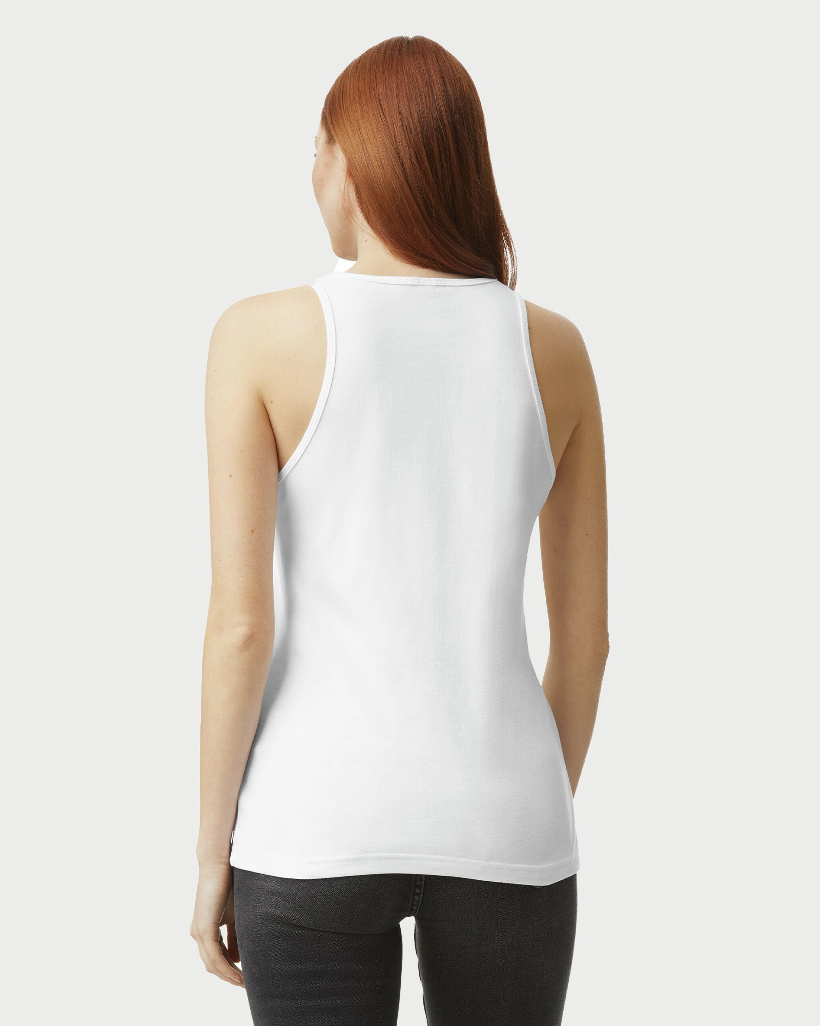 Female model wearing white CVC Women's Racerneck Tank Top- (back pose) -white