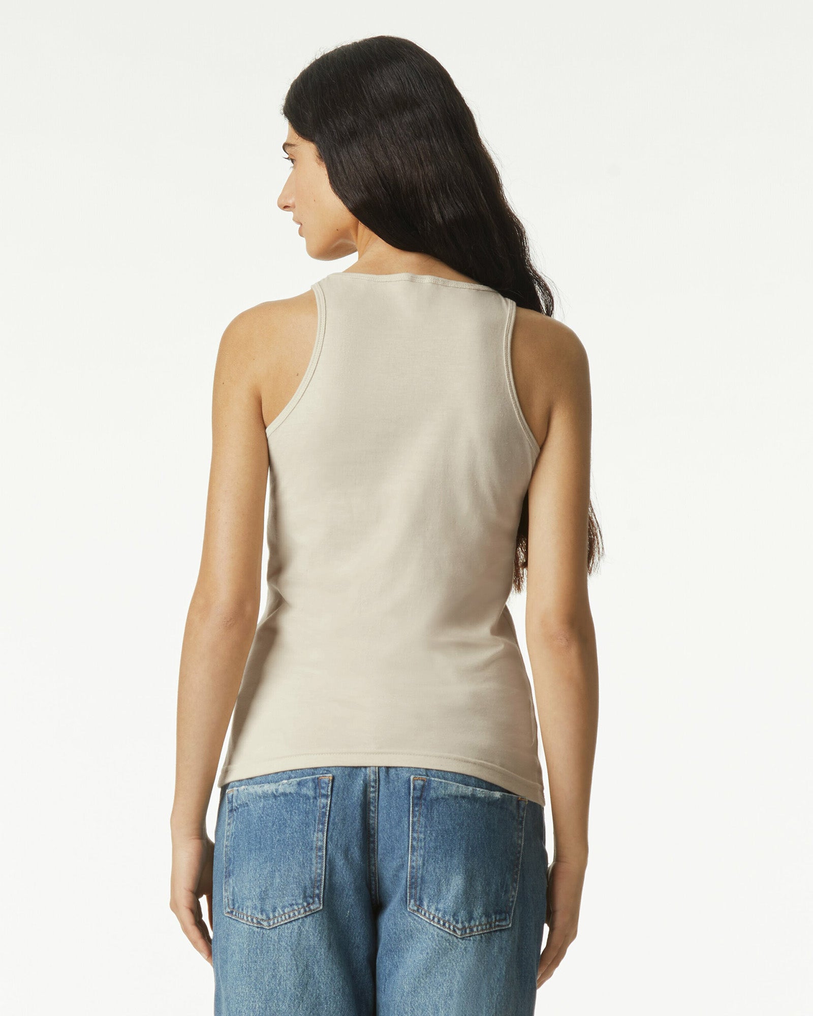 Female model wearing heather bone colour CVC Women's Racerneck Tank Top (back pose) -heather bone