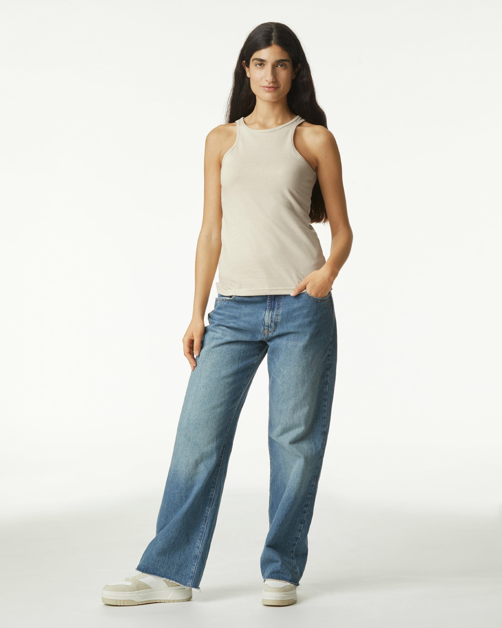 Female model wearing heather bone colour CVC Women's Racerneck Tank Top (front pose) -heather bone