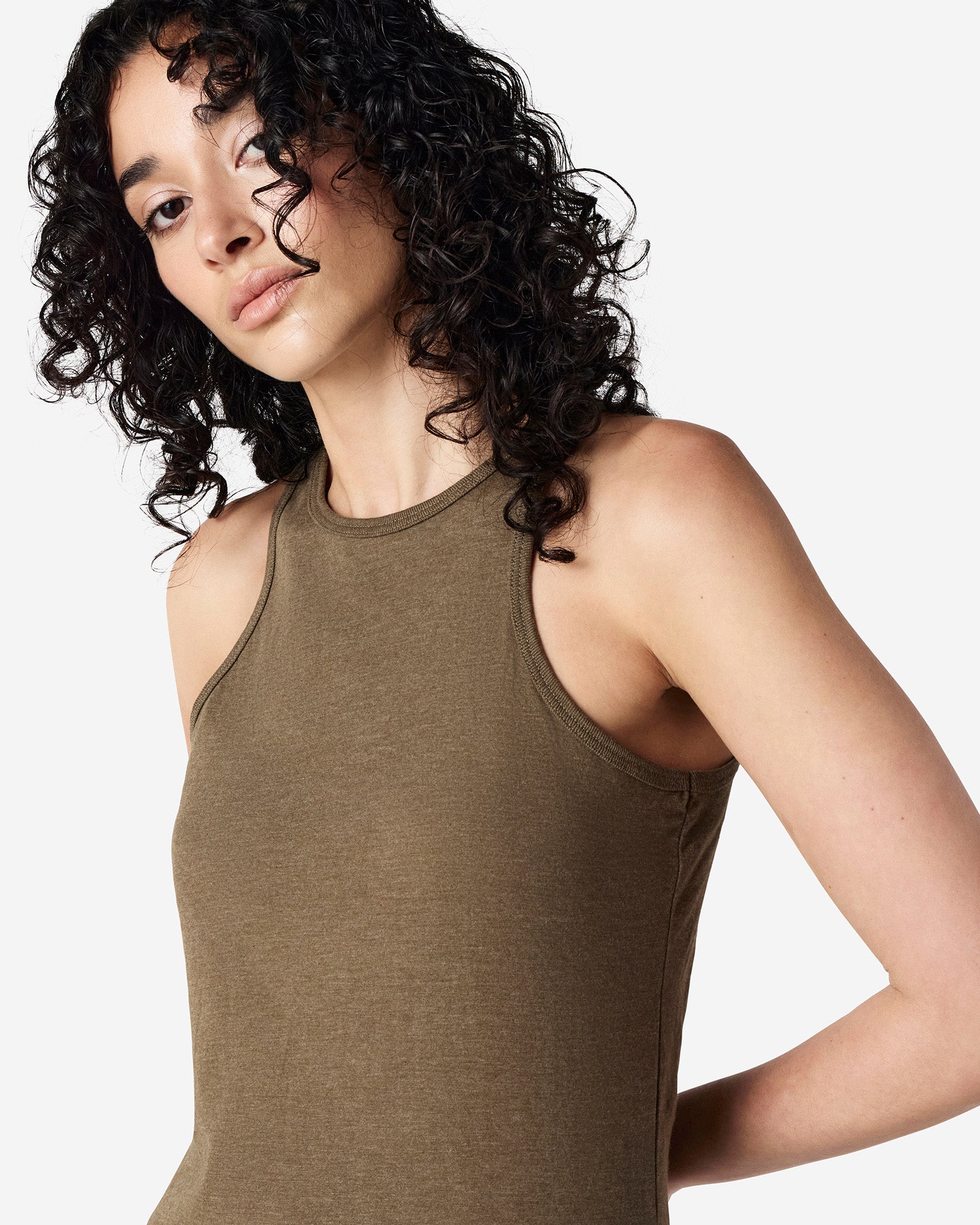 Close-up of a woman wearing American Apparel Racerneck tank top, highlighting the sleek neckline and fitted silhouette - heather army