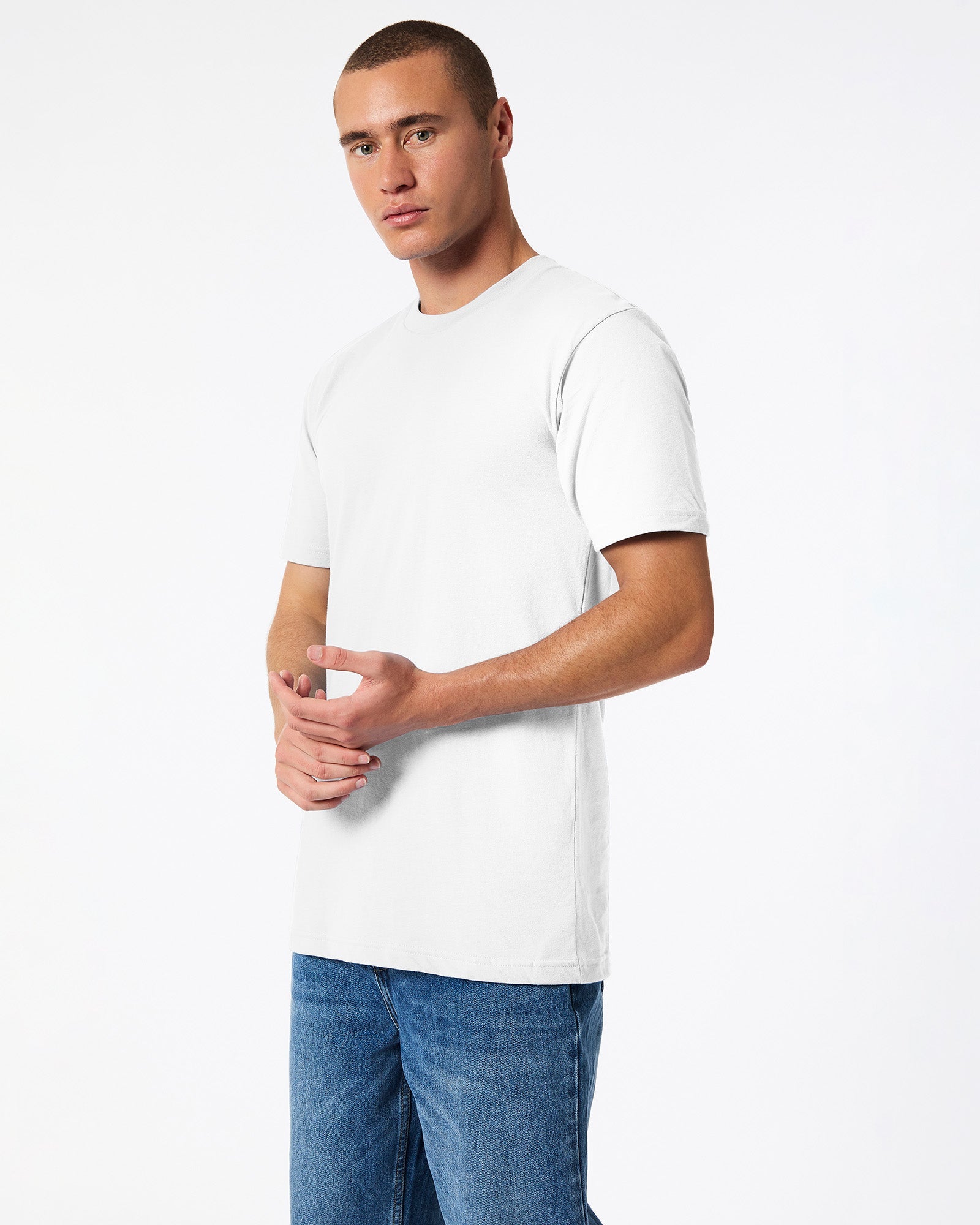 male model wearing white Fine Jersey Unisex Crew Neck Tee (side pose) -white