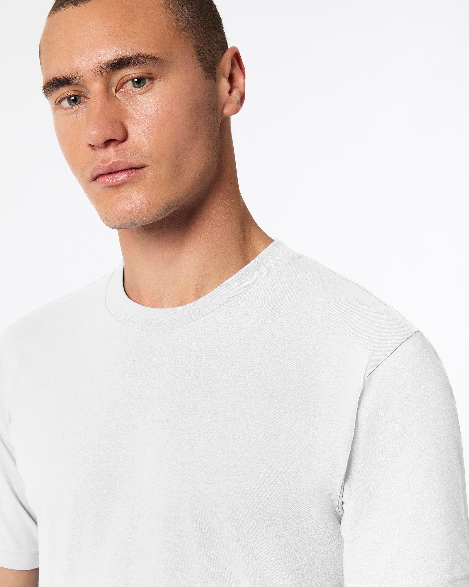 male model wearing white Fine Jersey Unisex Crew Neck Tee (half front pose) -white