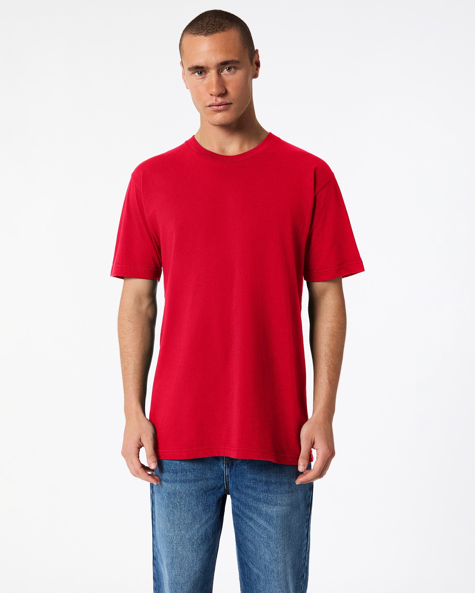 Male model wearing American Apparel Powder Red Colour Fine Jersey Unisex Short Sleeve Crew Neck Tee (front pose) -red