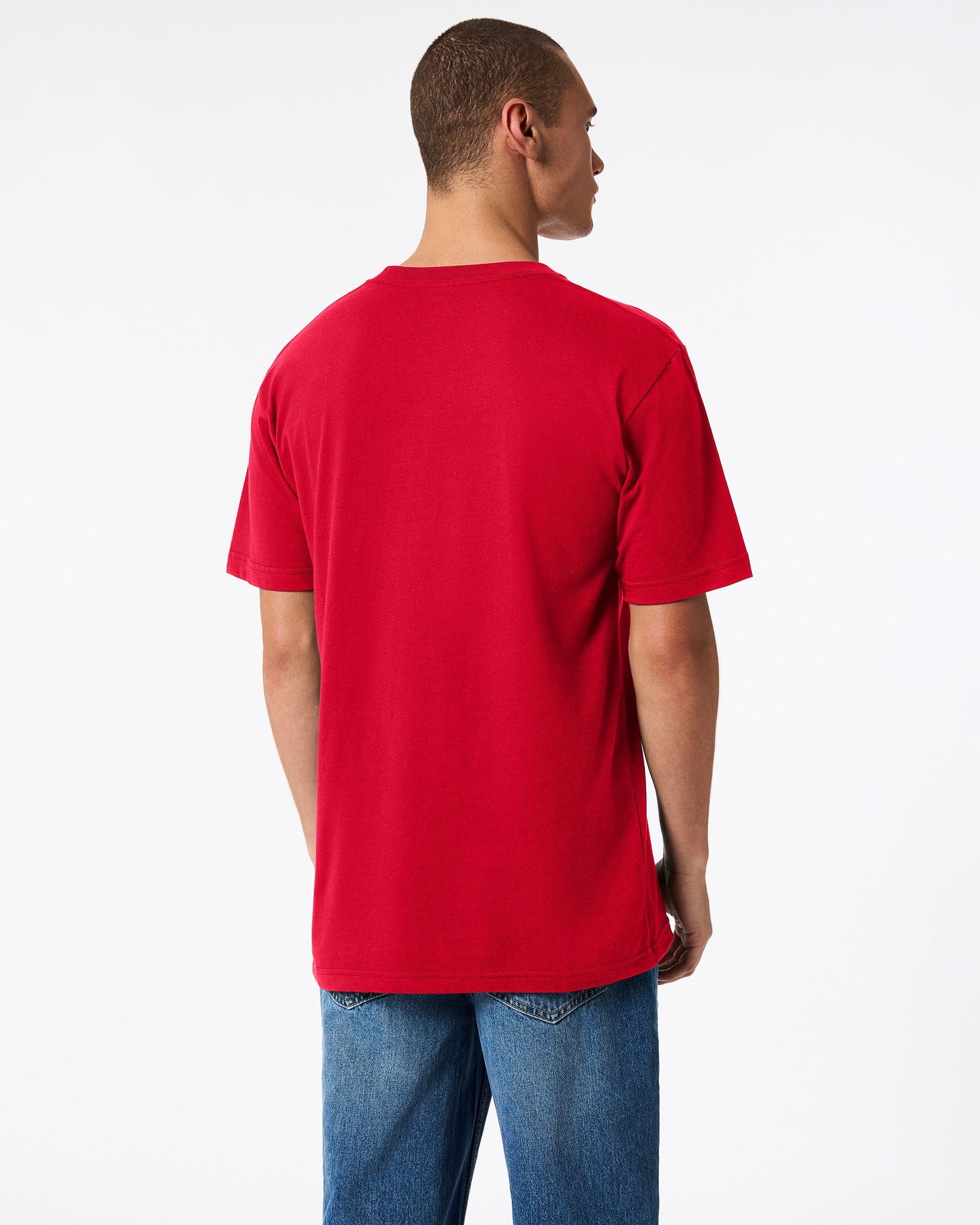 Male model wearing American Apparel Powder Red Colour Fine Jersey Unisex Short Sleeve Crew Neck Tee (back pose) -red
