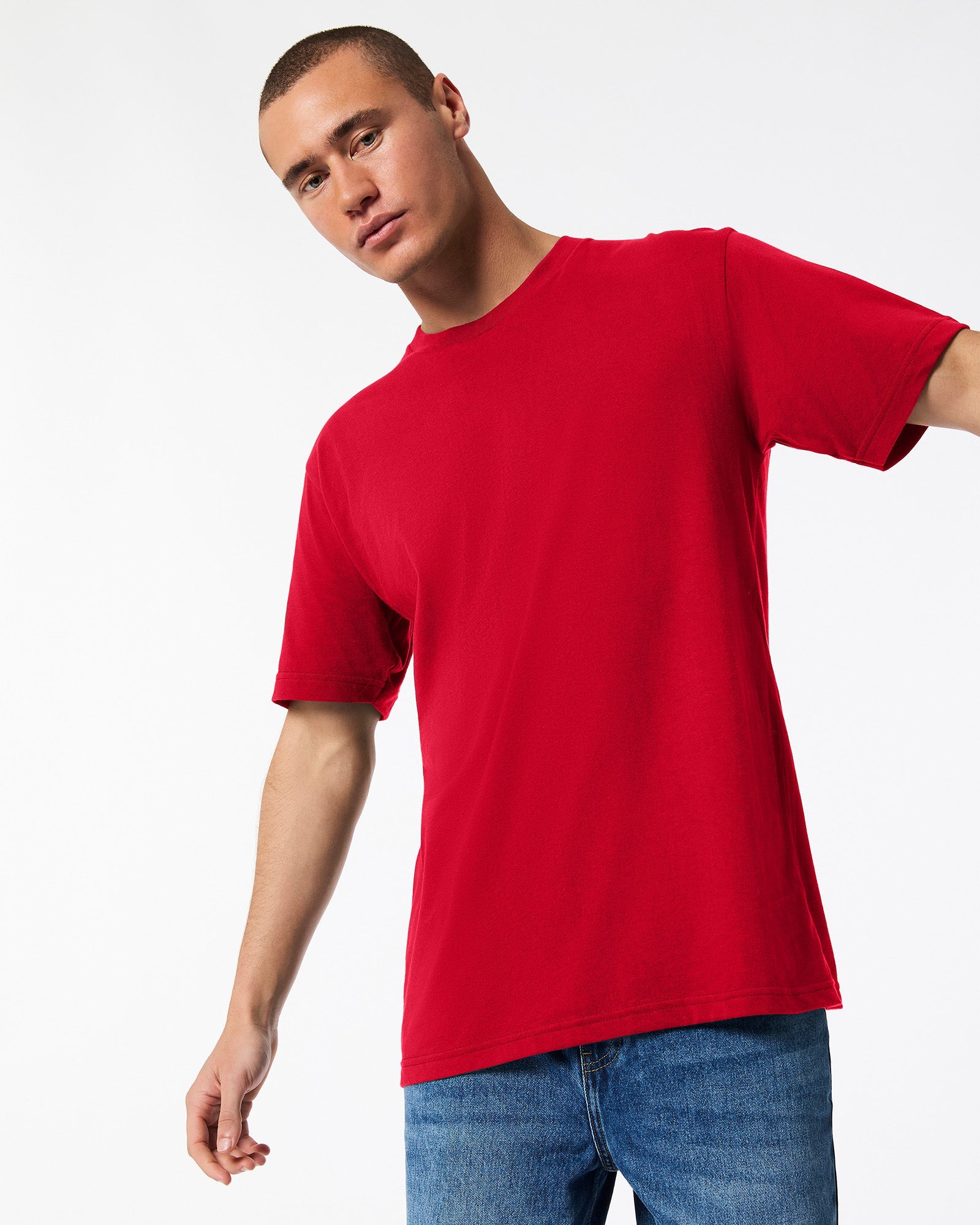 Male model wearing American Apparel Powder Red Colour Fine Jersey Unisex Short Sleeve Crew Neck Tee (front pose) -red