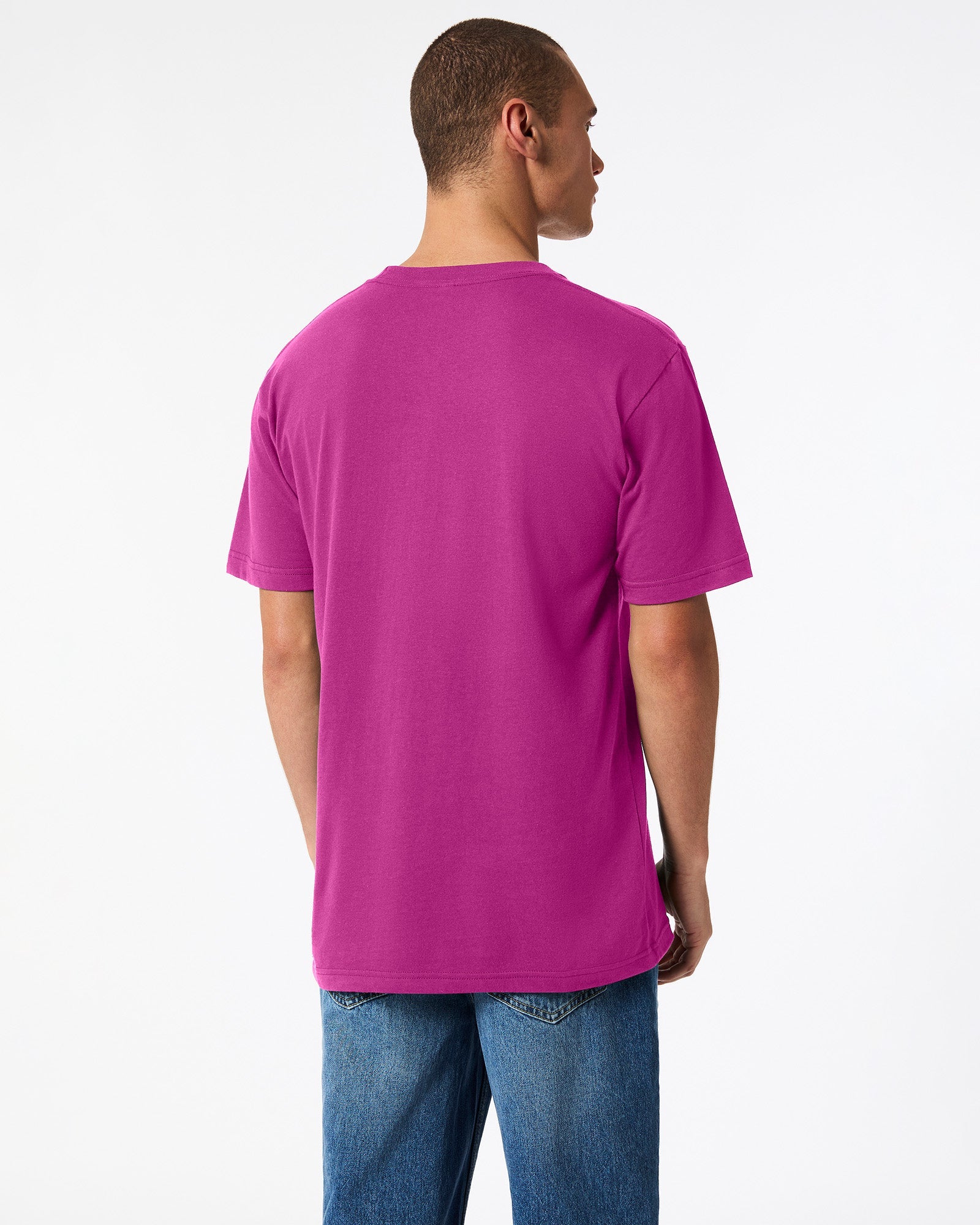 Male model wearing American Apparel Powder Super pink Colour Fine Jersey Unisex Short Sleeve Crew Neck Tee (back pose) -super pink