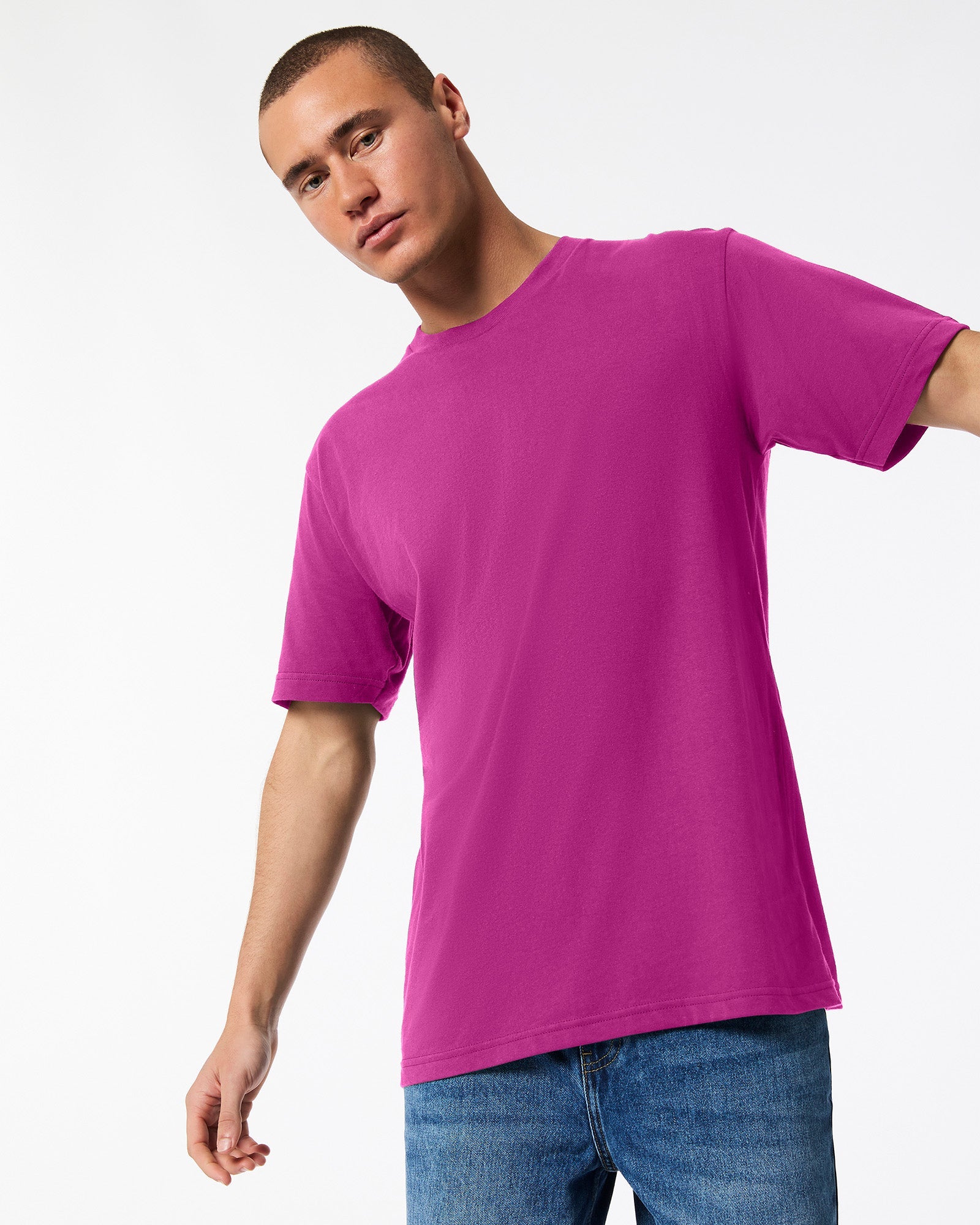 Male model wearing American Apparel Powder Super pink Colour Fine Jersey Unisex Short Sleeve Crew Neck Tee (front pose) -super pink