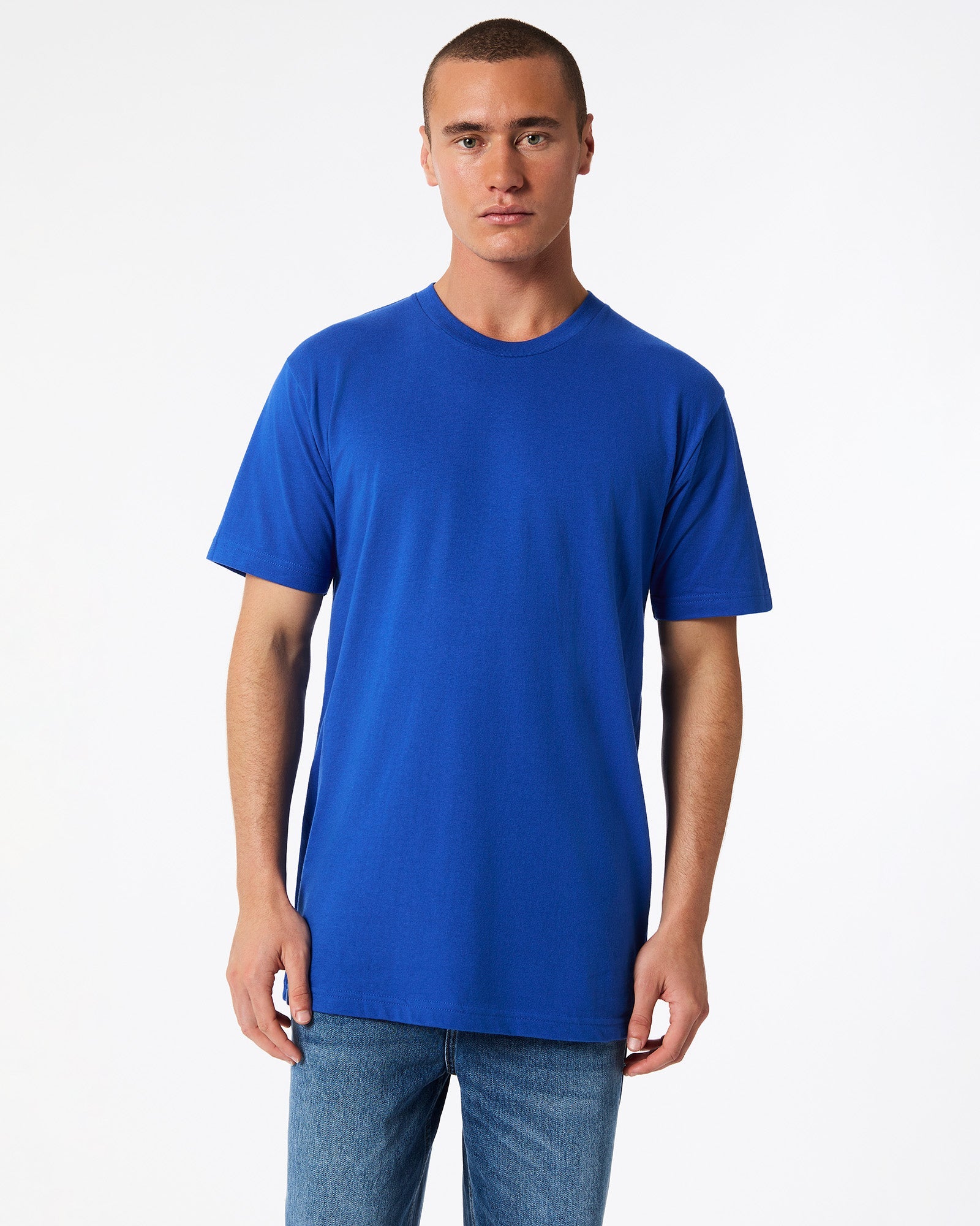 Male model wearing American Apparel Powder Royal Blue Colour Fine Jersey Unisex Short Sleeve Crew Neck Tee (front pose) -royal blue