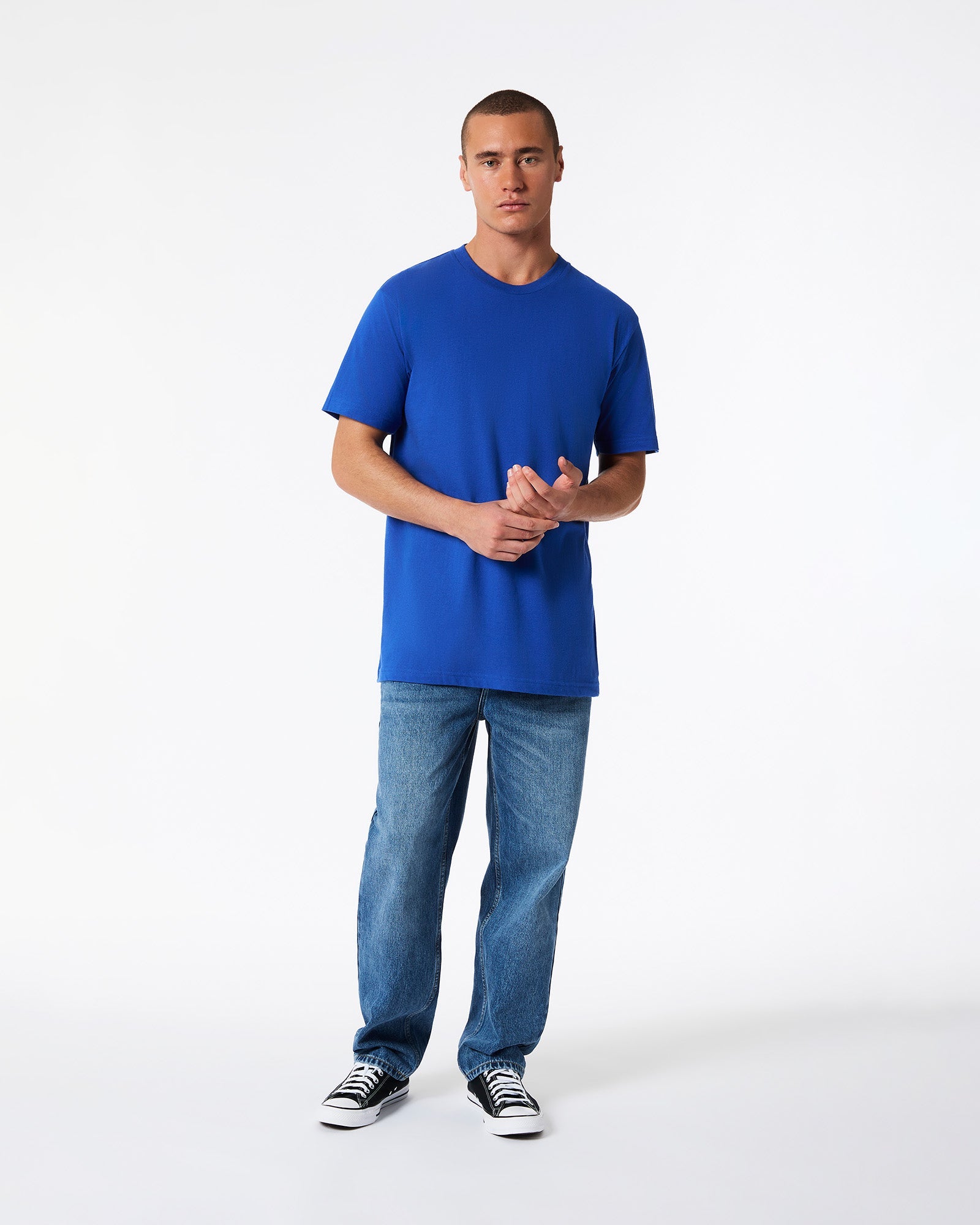 Male model wearing American Apparel Powder Royal Blue Colour Fine Jersey Unisex Short Sleeve Crew Neck Tee (front pose) -royal blue