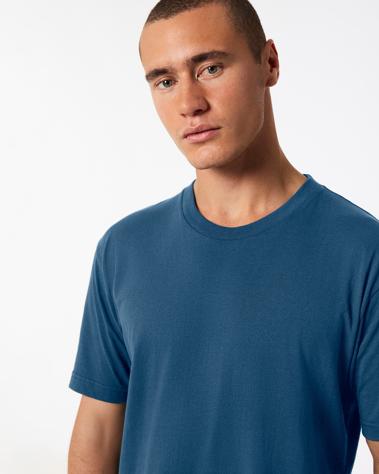 Male model wearing American Apparel Powder sea Blue Colour Fine Jersey Unisex Short Sleeve Crew Neck Tee (half front pose) -sea blue