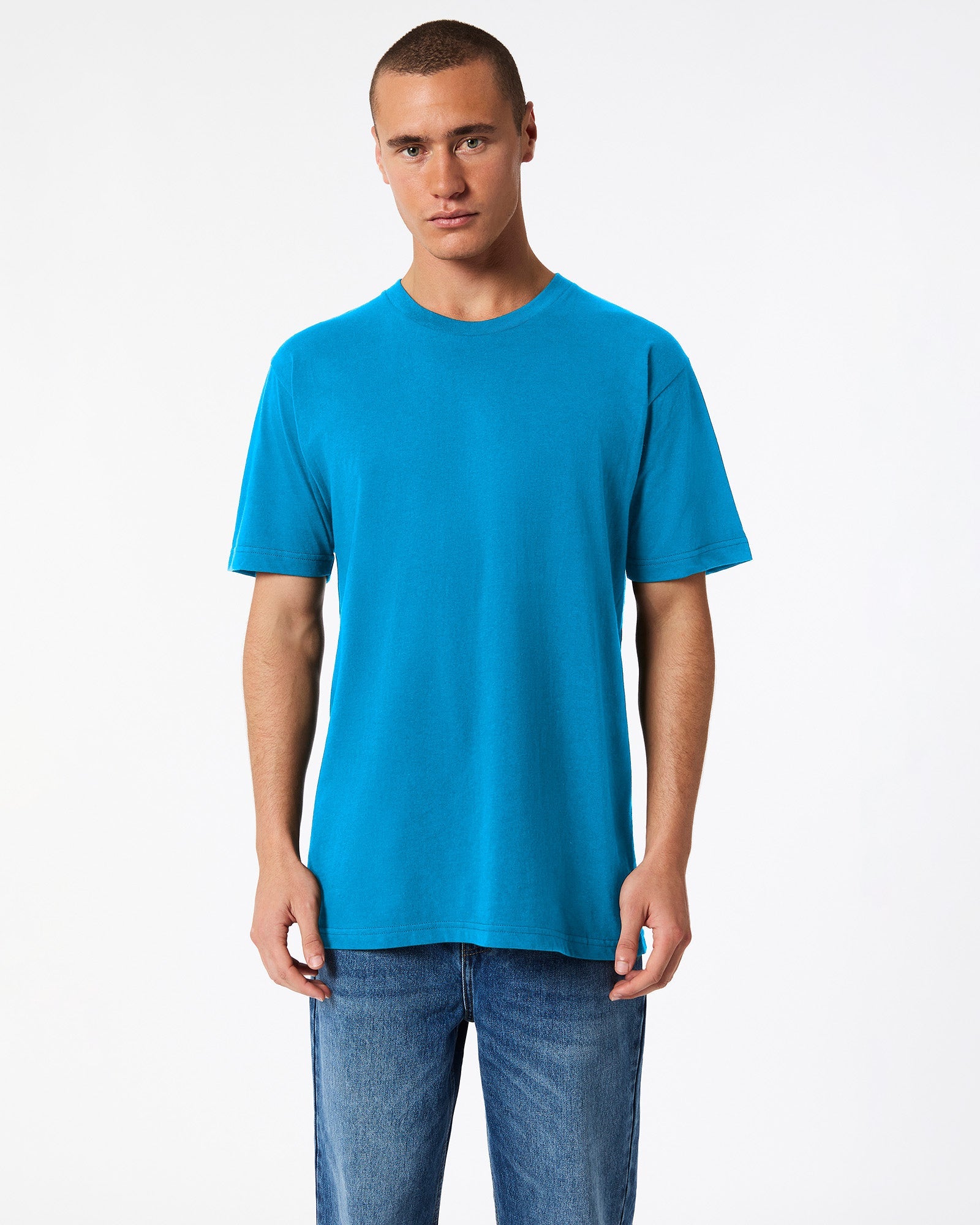 Male model wearing American Apparel Powder teal Colour Fine Jersey Unisex Short Sleeve Crew Neck Tee (front pose) -teal