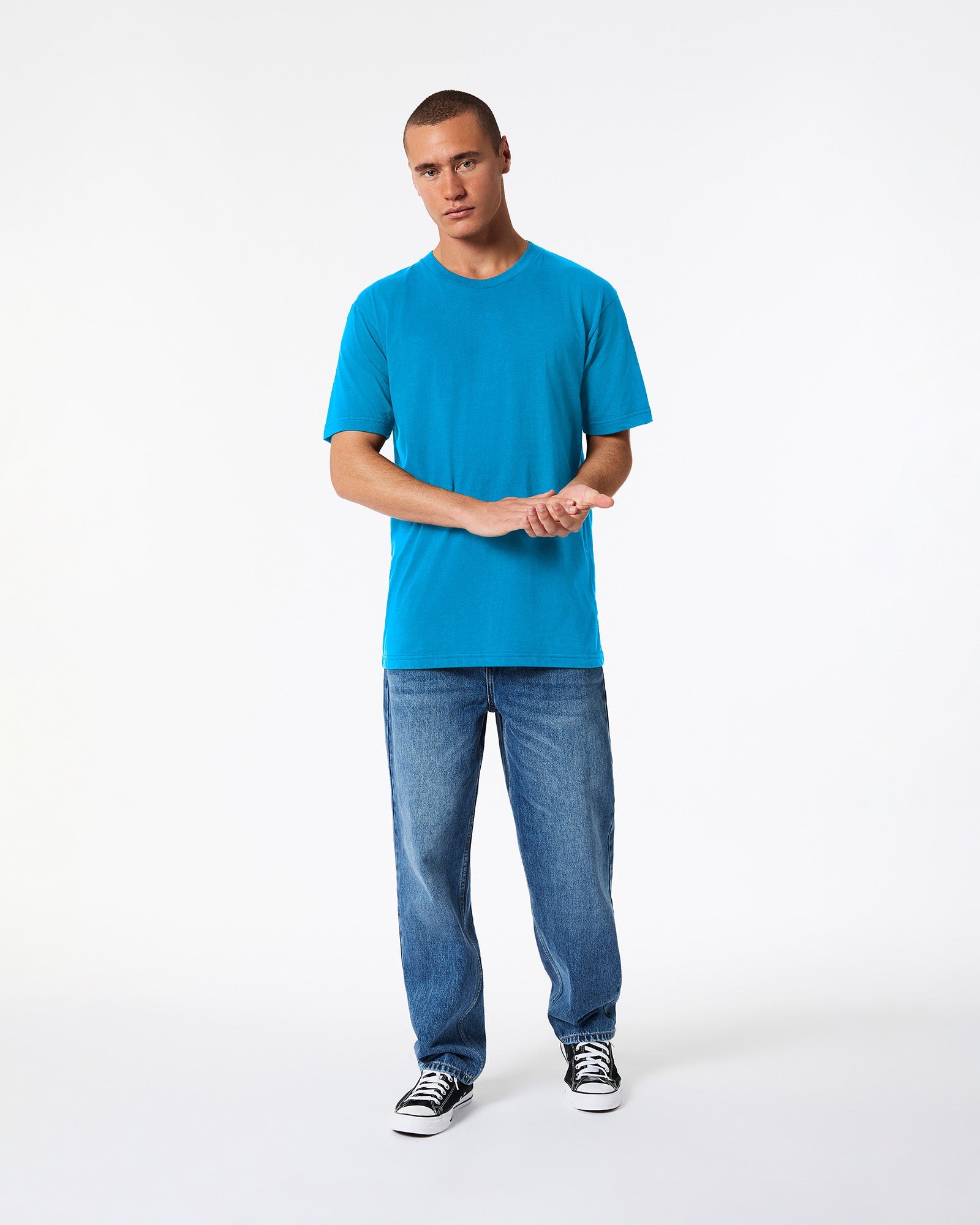 Male model wearing American Apparel Powder teal Colour Fine Jersey Unisex Short Sleeve Crew Neck Tee (front pose) -teal