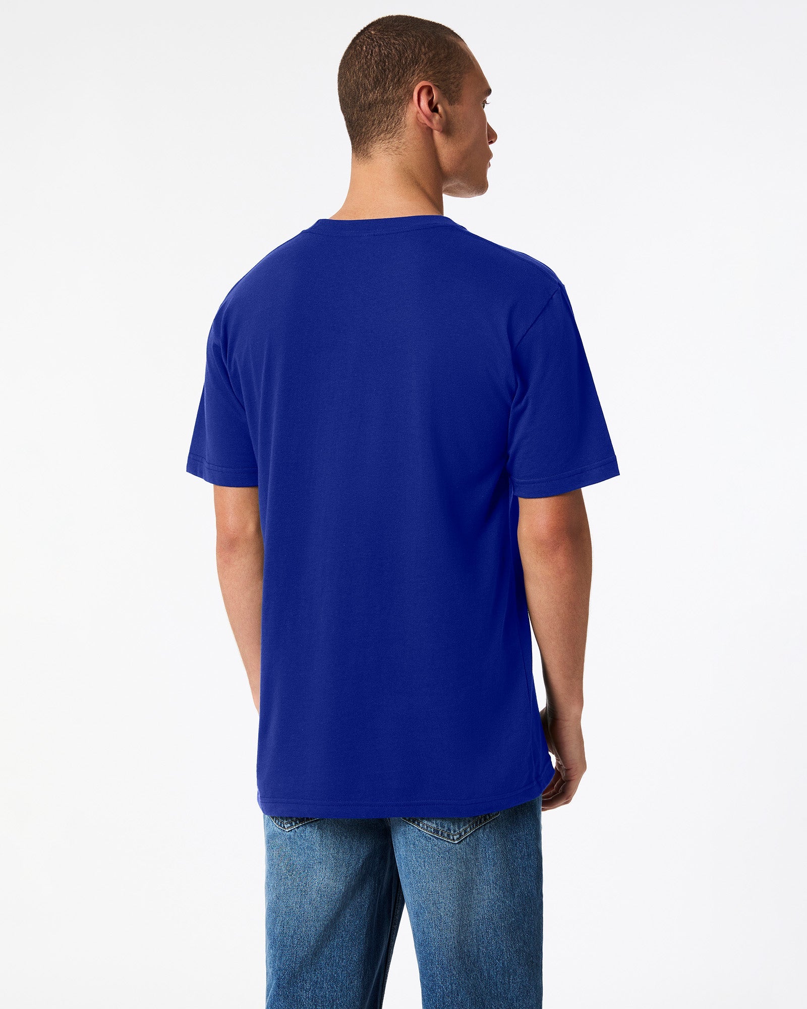 male model wearing Lapis colour Fine Jersey Unisex Crew Neck Tee (back pose) -lapis