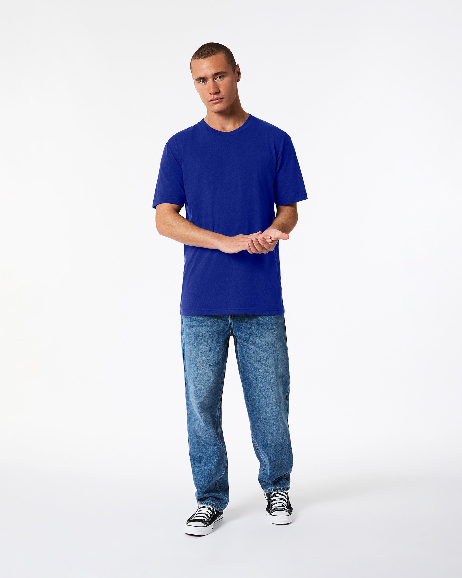 male model wearing Lapis colour Fine Jersey Unisex Crew Neck Tee (front pose) -lapis