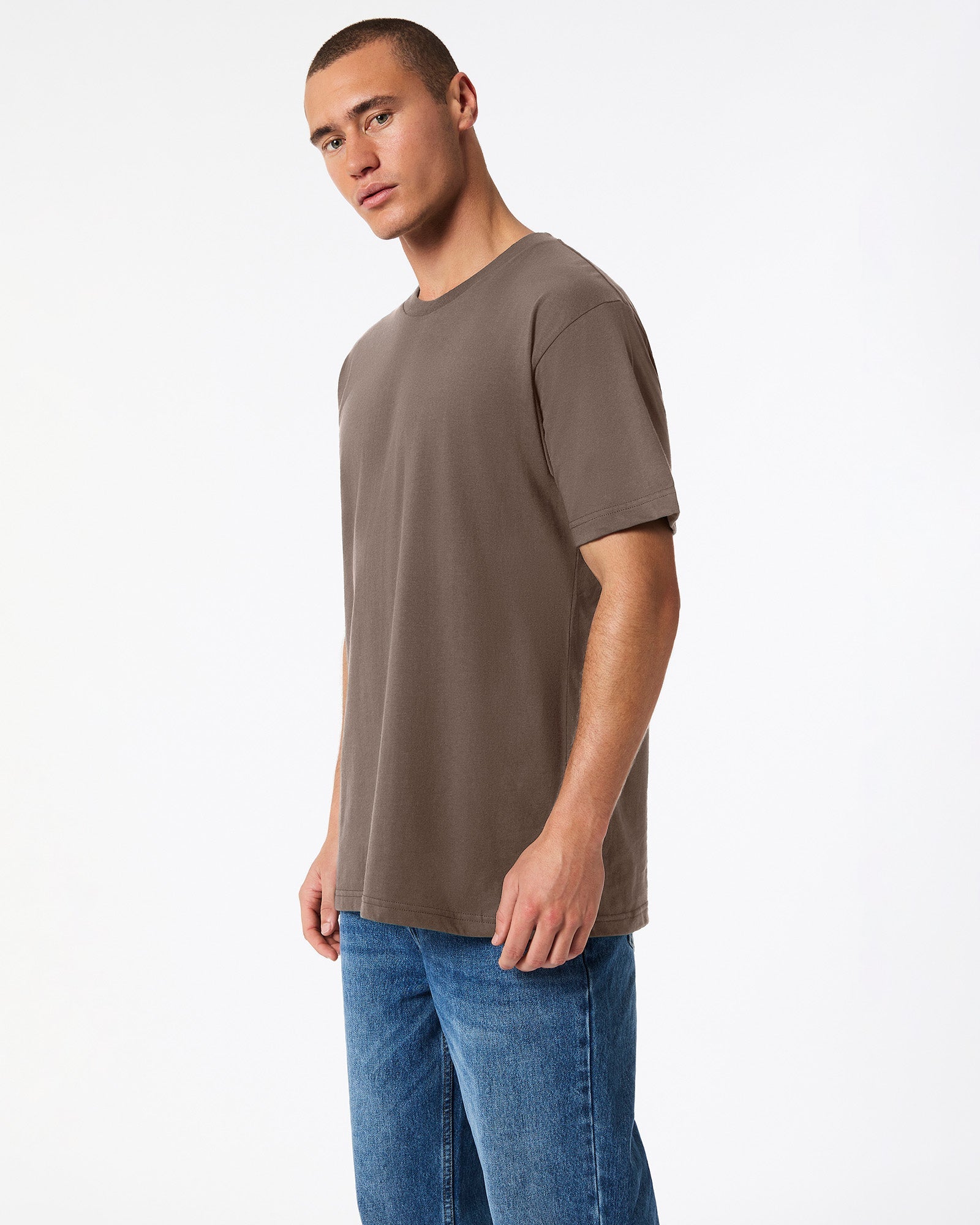 Fine Jersey Male mode wearing brown colour American Apparel Unisex Short Sleeve Crew Neck Tee (side pose) -brown