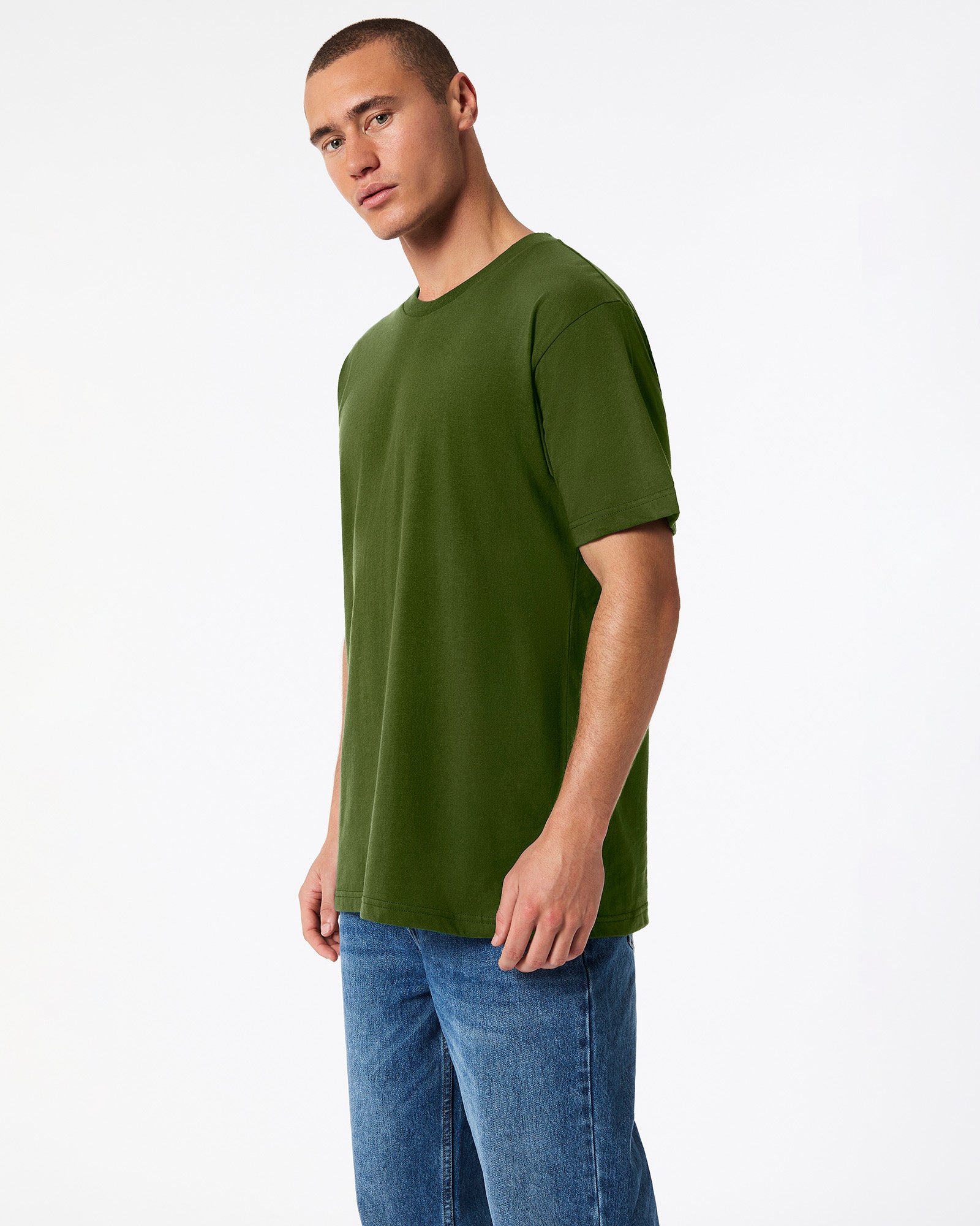male model wearing olive colour Fine Jersey Unisex Crew Neck Tee (side pose) -olive