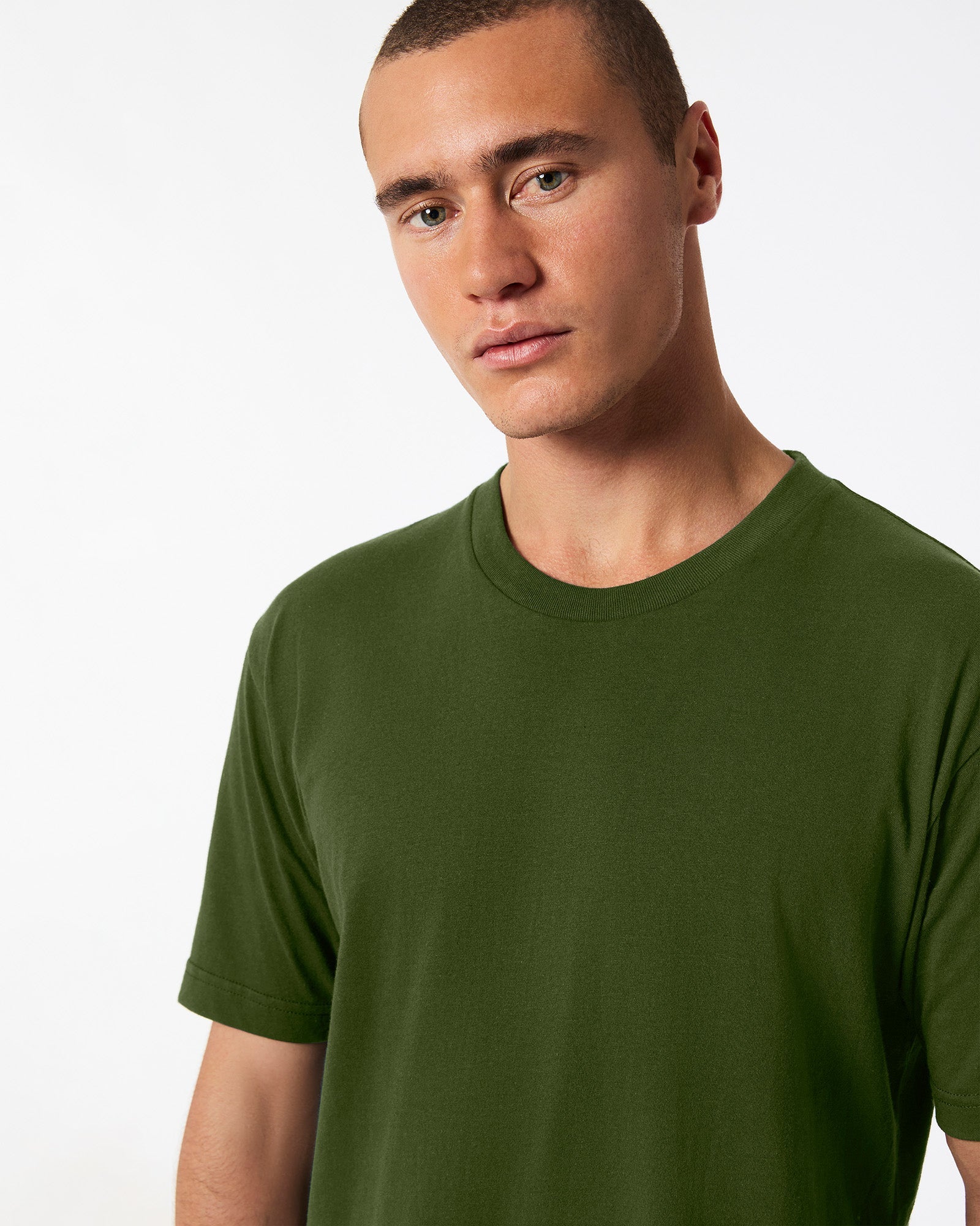 male model wearing olive colour Fine Jersey Unisex Crew Neck Tee (half front pose) -olive