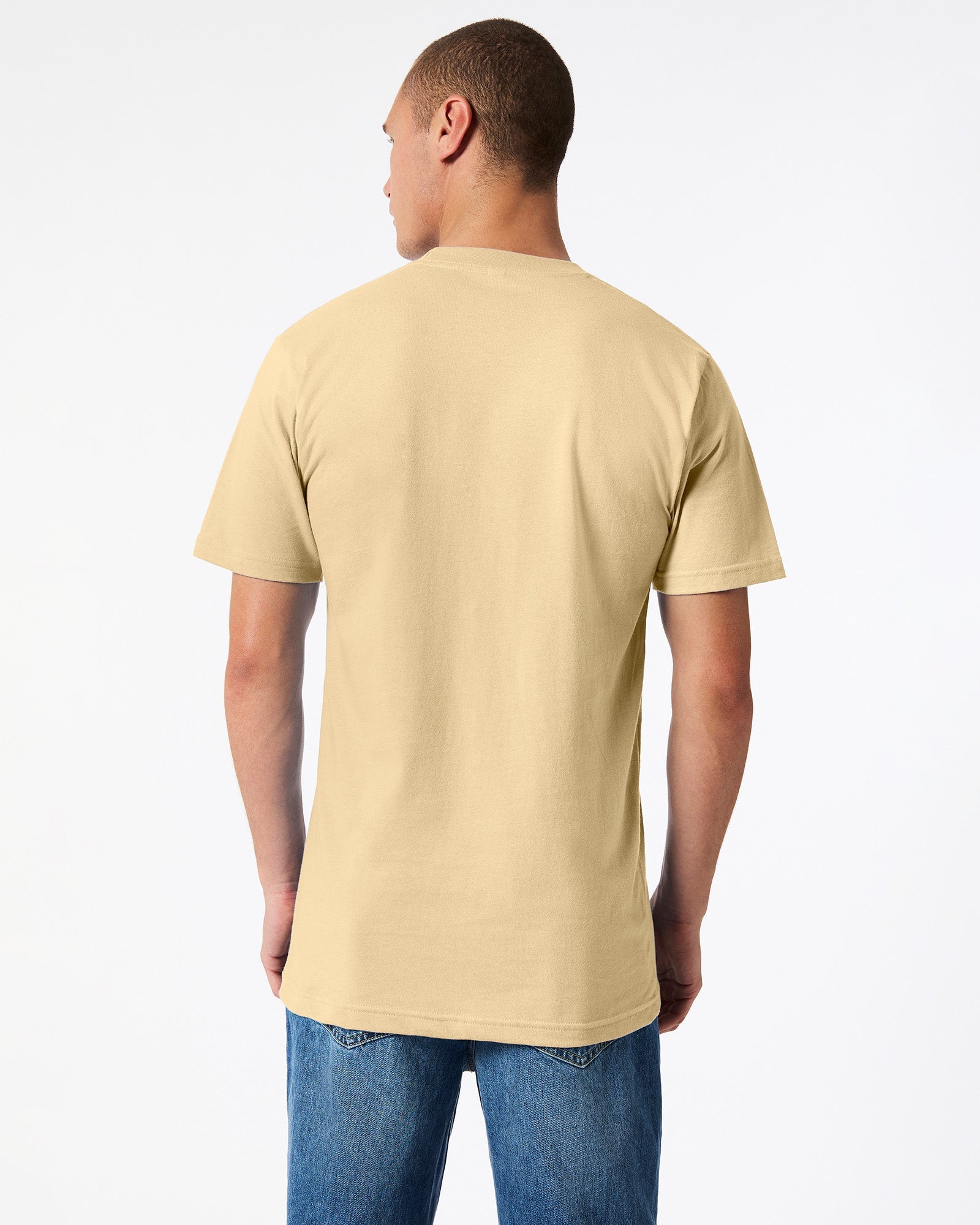 Male mode wearing cream colour American Apparel Fine jersey Unisex Short Sleeve Crew Neck Tee (back pose) -cream