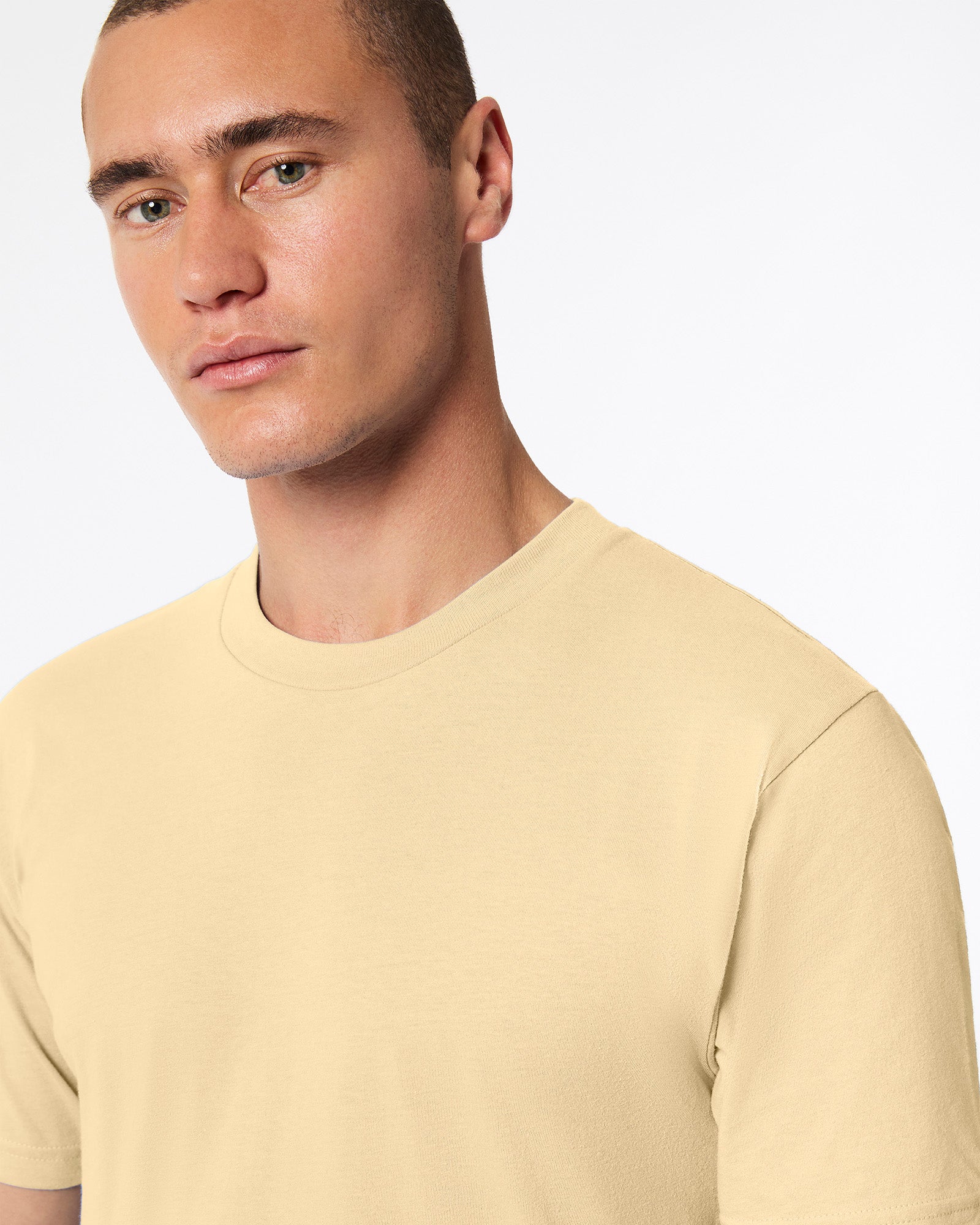 Male mode wearing cream colour American Apparel Fine jersey Unisex Short Sleeve Crew Neck Tee (half Front pose) -cream