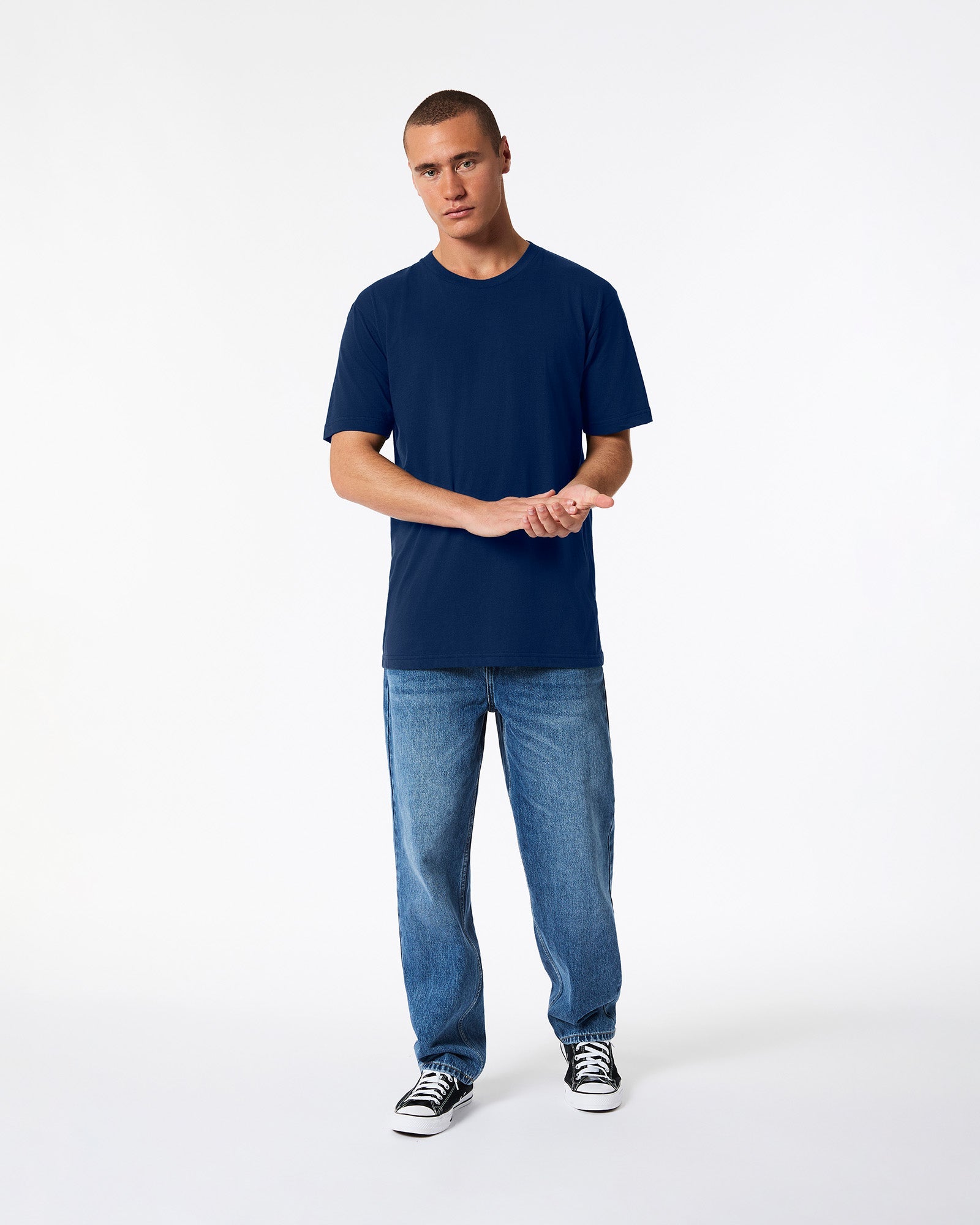 male model wearing Navy colour Fine Jersey Unisex Crew Neck Tee (front pose) -navy