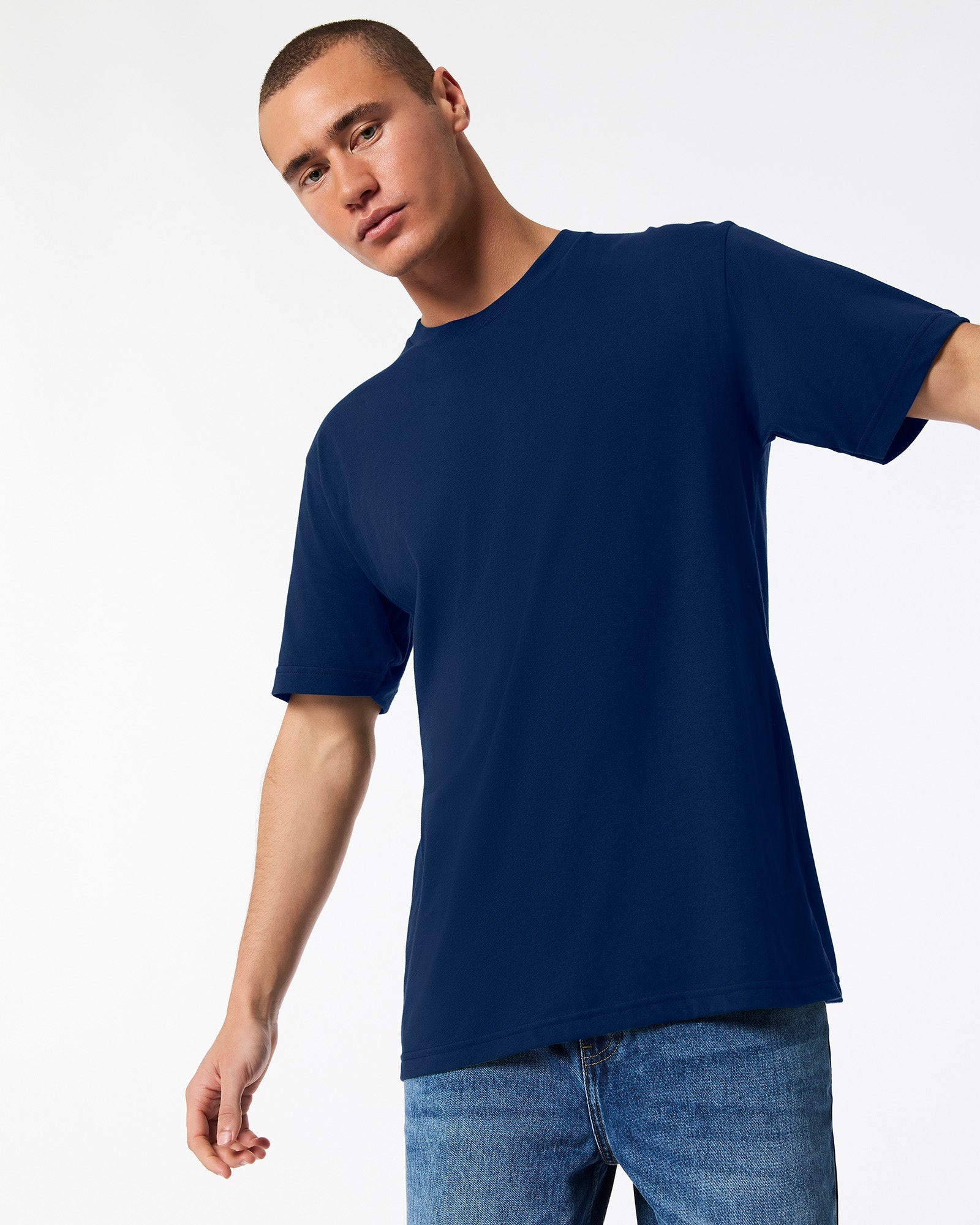 male model wearing Navy colour Fine Jersey Unisex Crew Neck Tee (front pose) -navy
