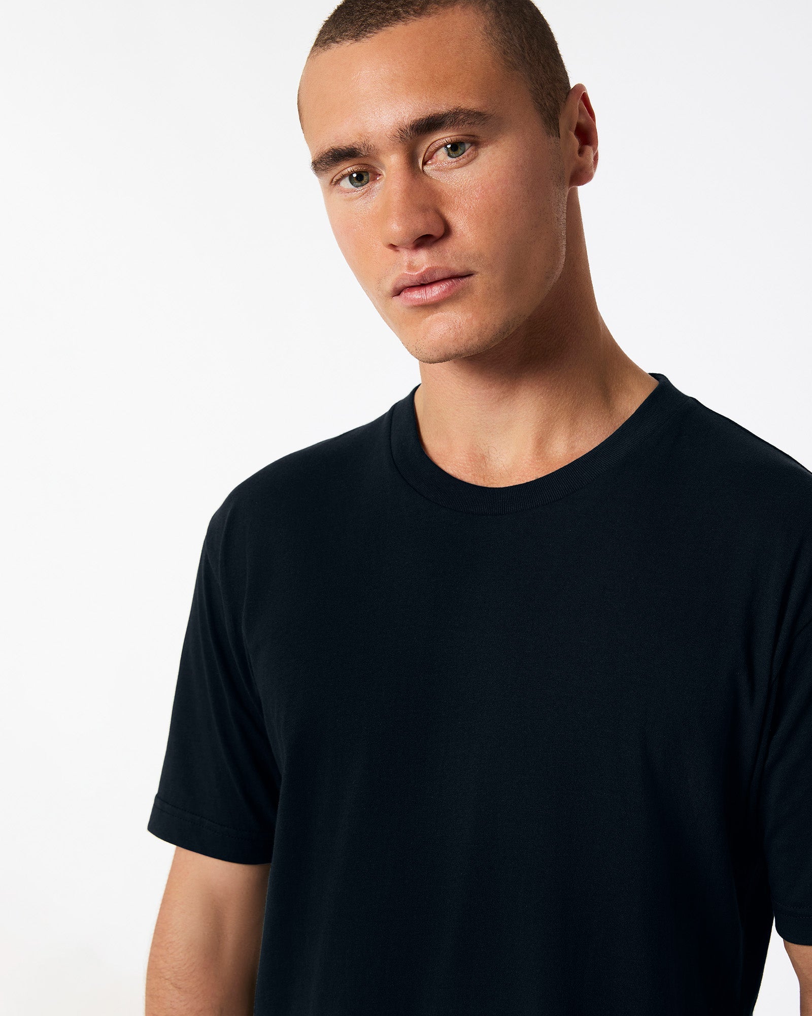 Fine Jersey Male mode wearing black colour American Apparel Unisex Short Sleeve Crew Neck Tee (Half Front pose) -black