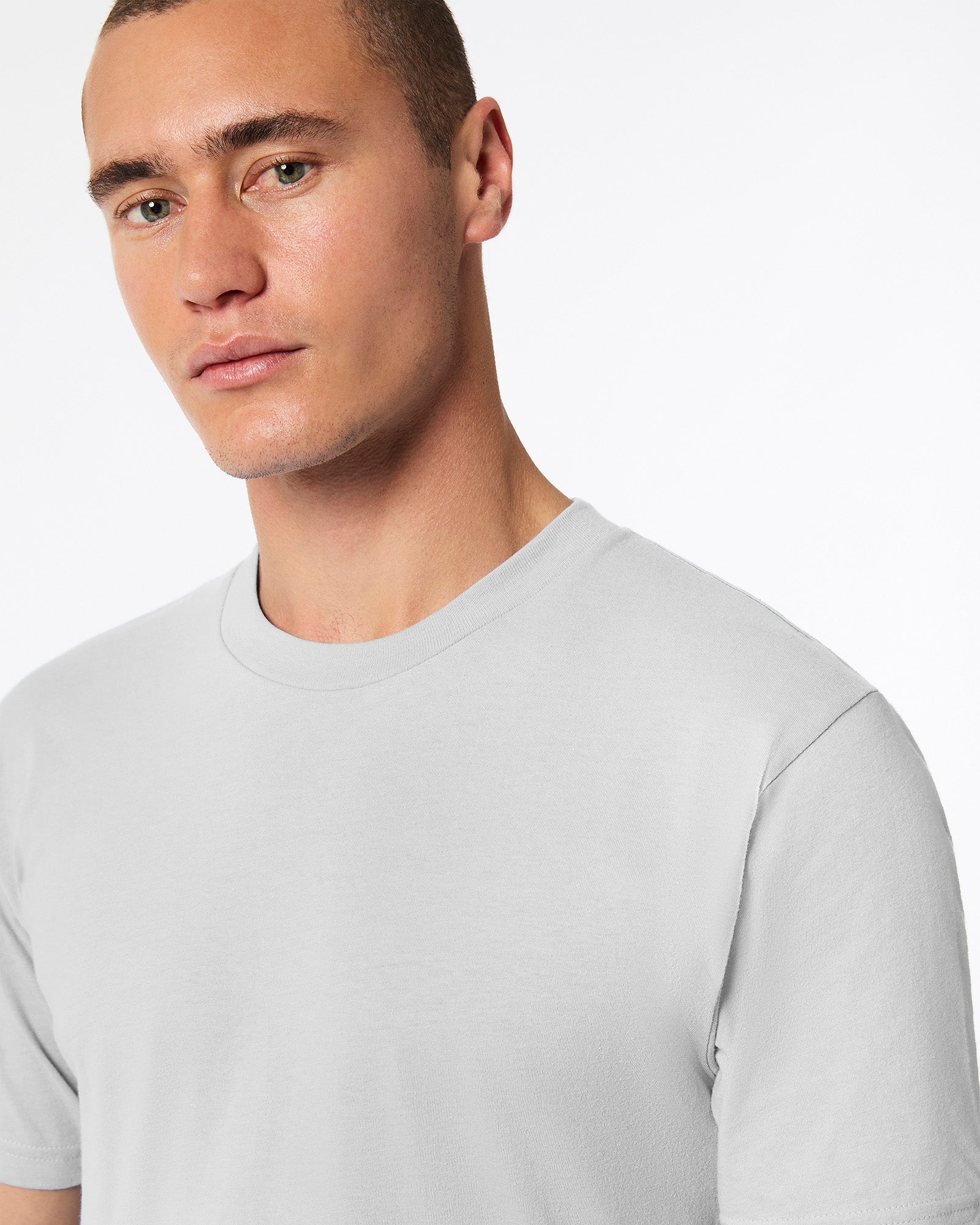 male model wearing new silver colour Fine Jersey Unisex Crew Neck Tee (half front pose) -new silver