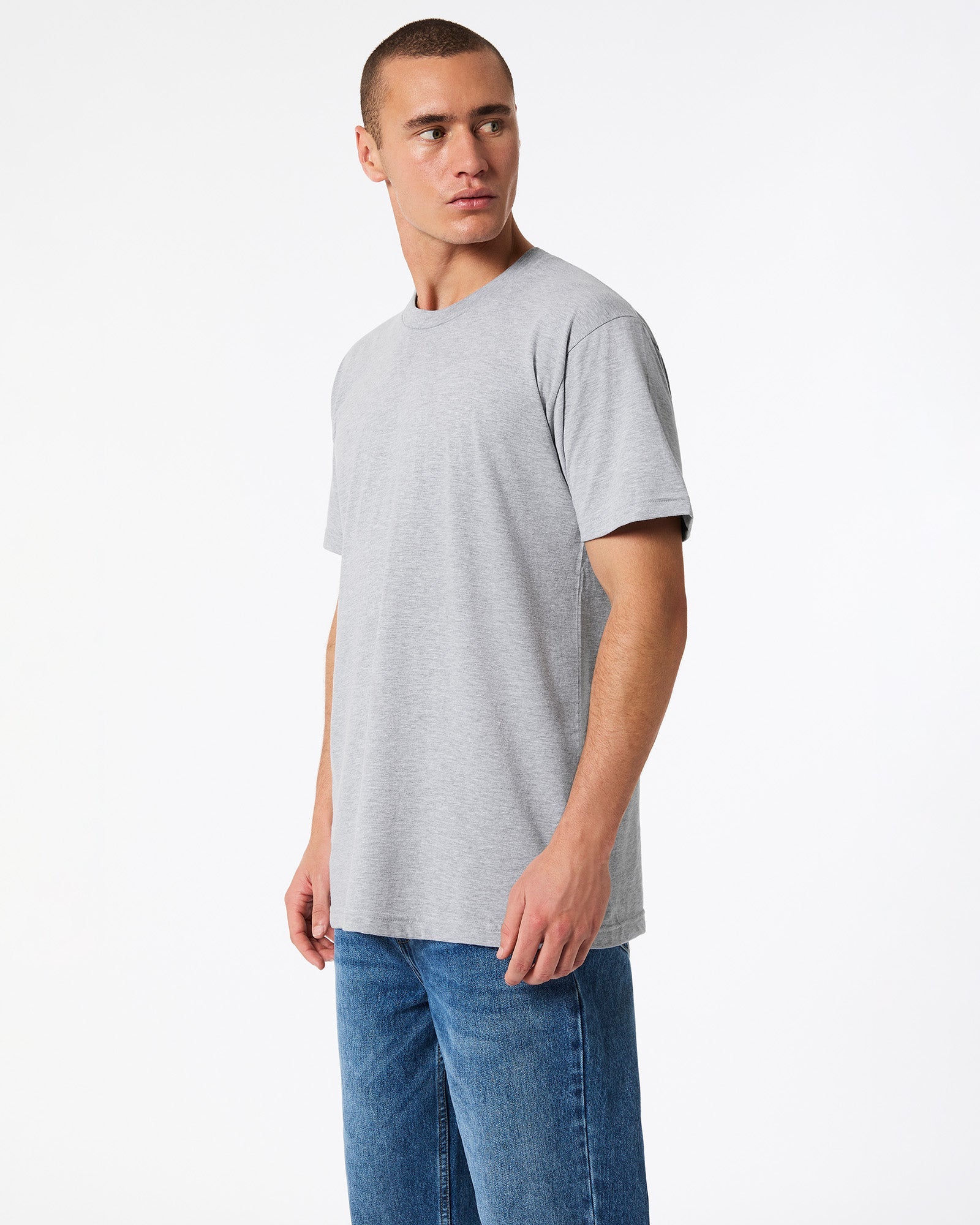 male model wearing heather grey colour Fine Jersey Unisex Crew Neck Tee (side pose) -heather grey