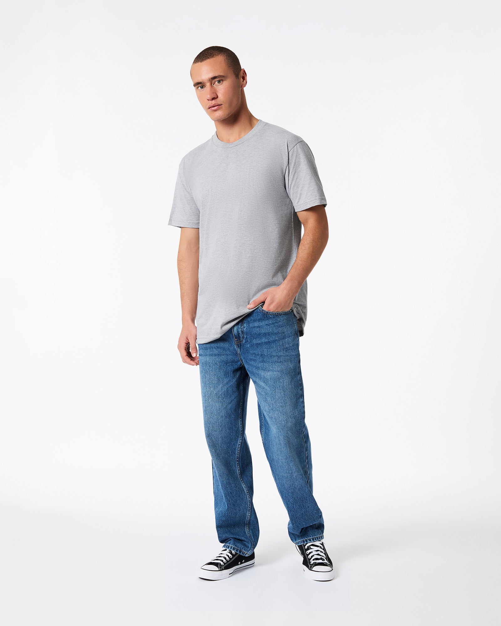 male model wearing heather grey colour Fine Jersey Unisex Crew Neck Tee (hand in pocket pose) -heather grey