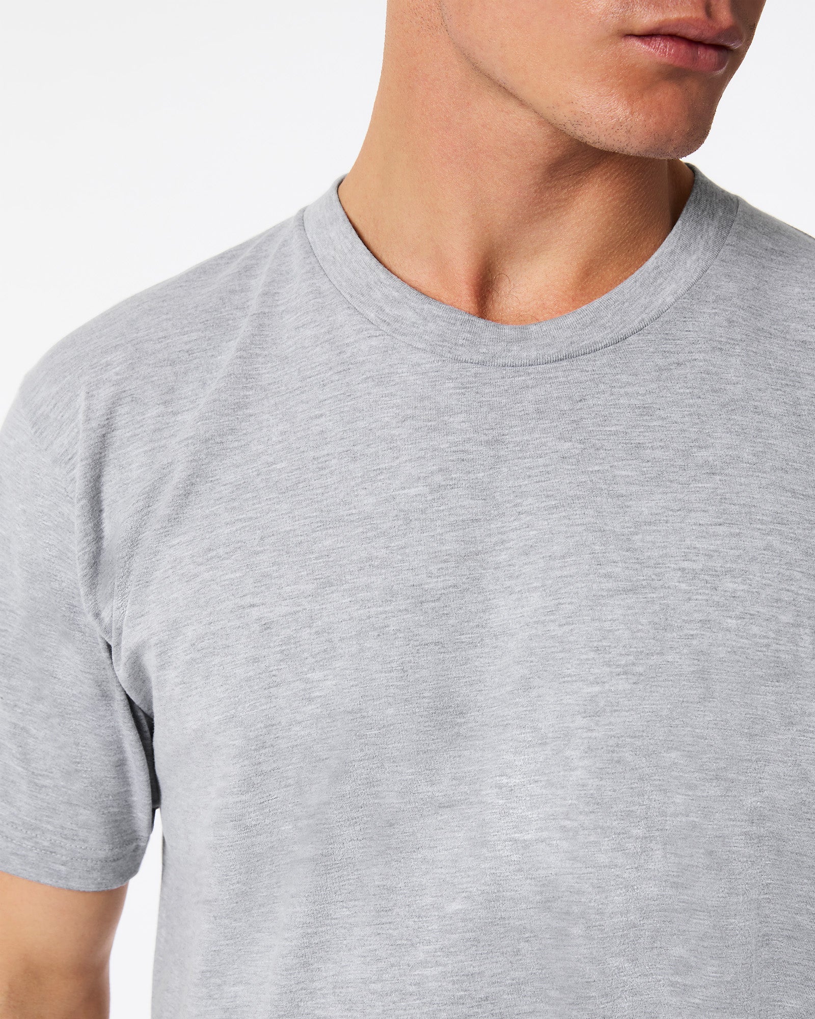 male model wearing heather grey colour Fine Jersey Unisex Crew Neck Tee (half front pose) -heather grey