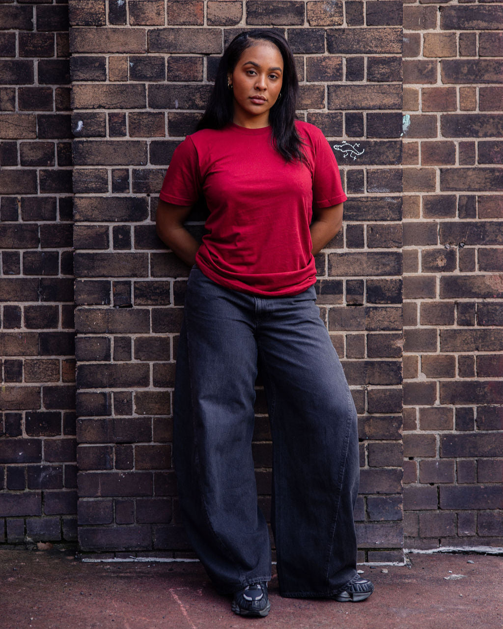 Female mode wearing cranberry colour American Apparel Fine jersey Unisex Short Sleeve Crew Neck Tee (Front pose) -cranberry