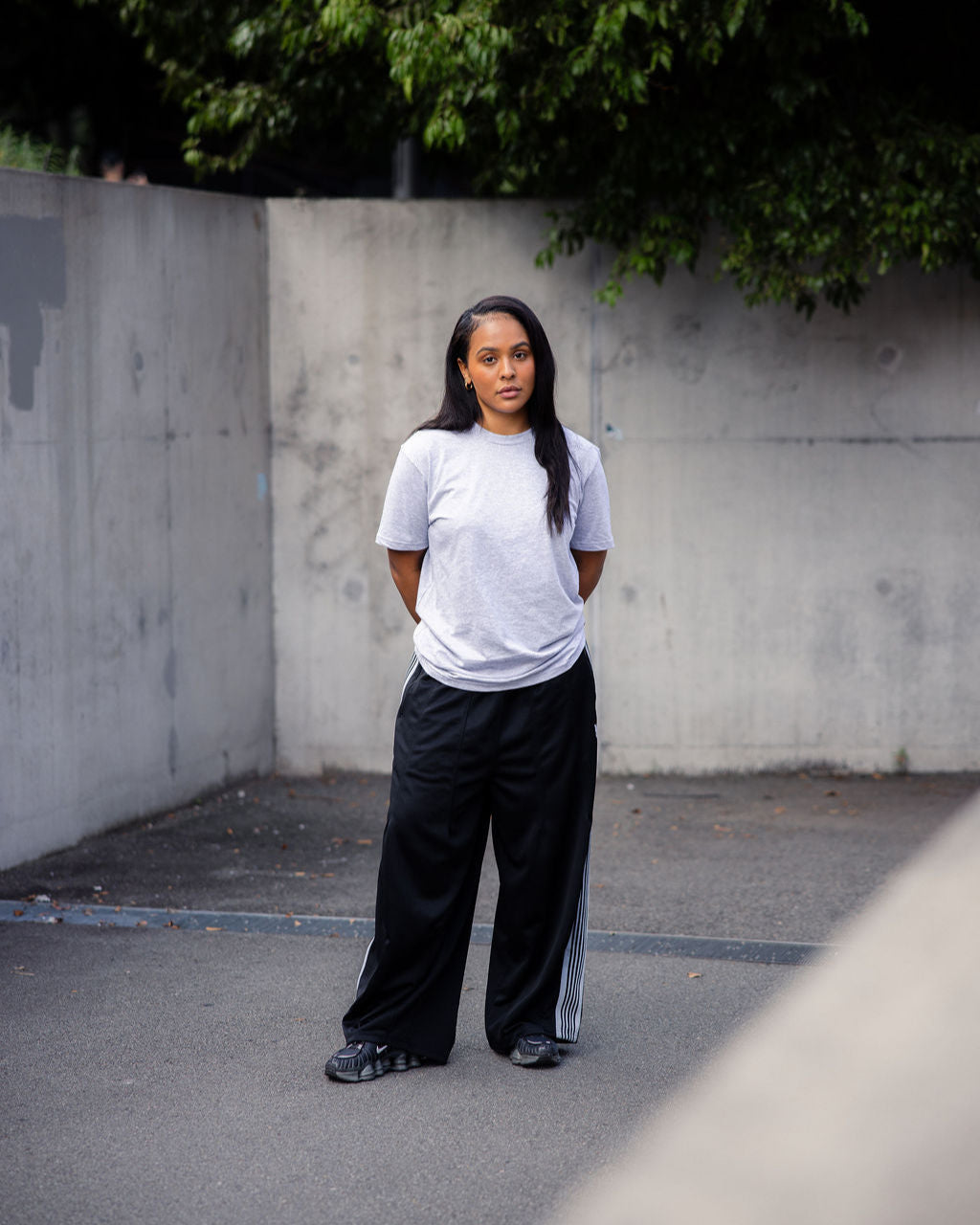 female model wearing heather grey colour Fine Jersey Unisex Crew Neck Tee (front pose) -heather grey