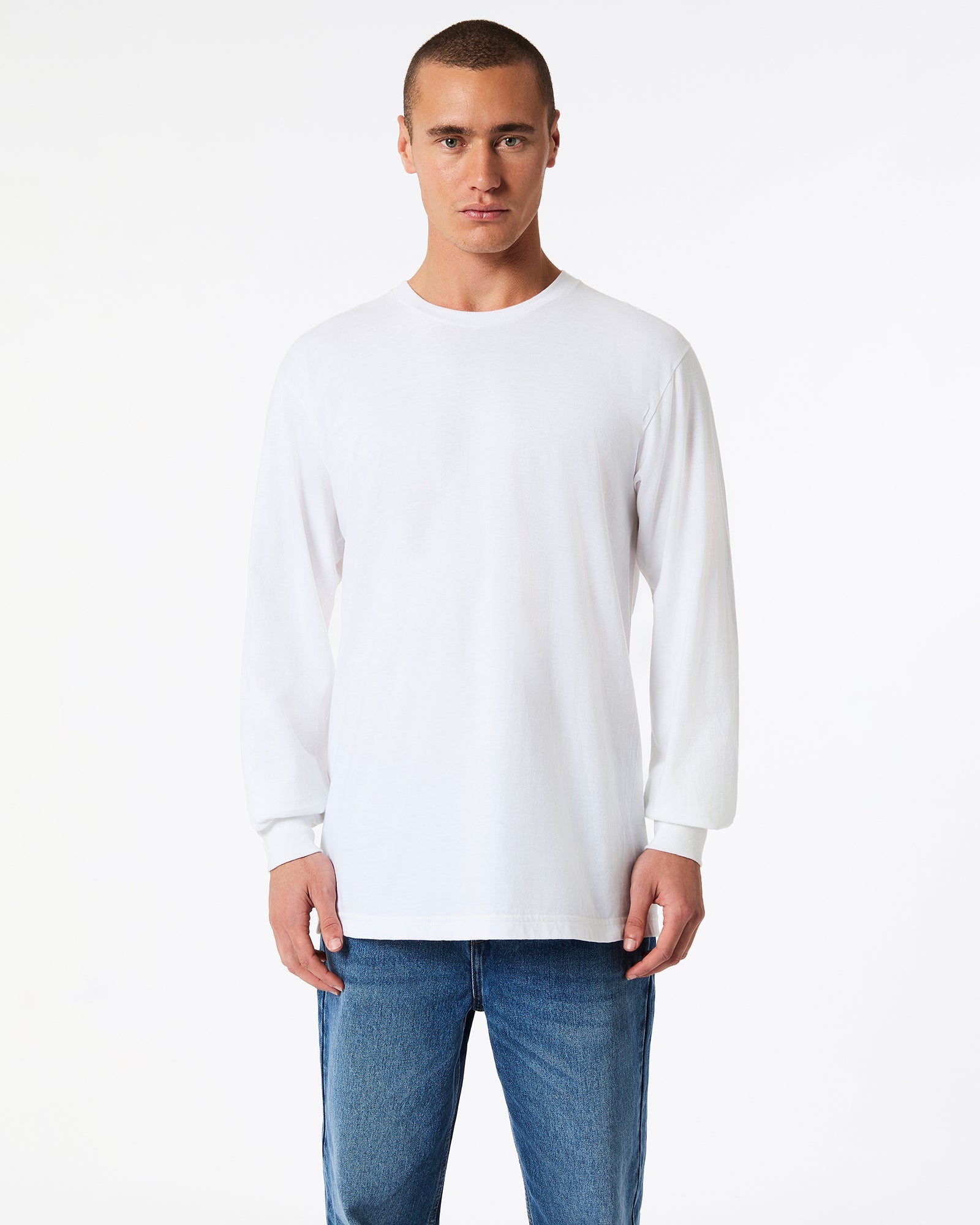 male model wearing American Apparel white Colour Fine Jersey Unisex Long Sleeve Crew Neck Tee (Front pose) -white