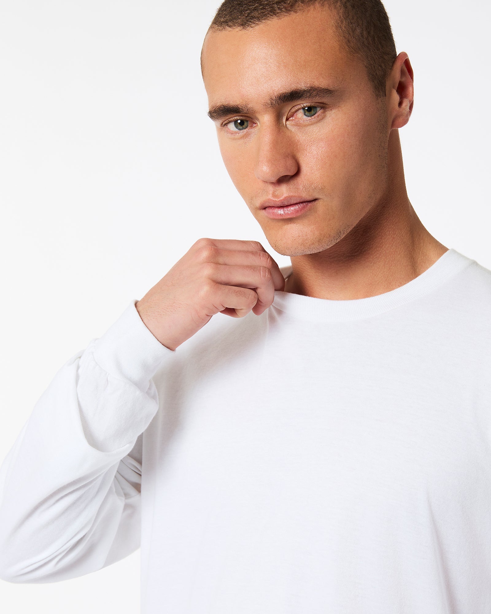 male model wearing American Apparel white Colour Fine Jersey Unisex Long Sleeve Crew Neck Tee (half Front pose) -white