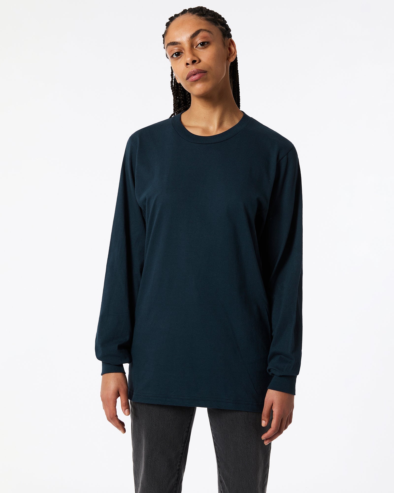 Female model wearing American Apparel Navy Colour Fine Jersey Unisex Long Sleeve Crew Neck Tee (Front pose) -navy