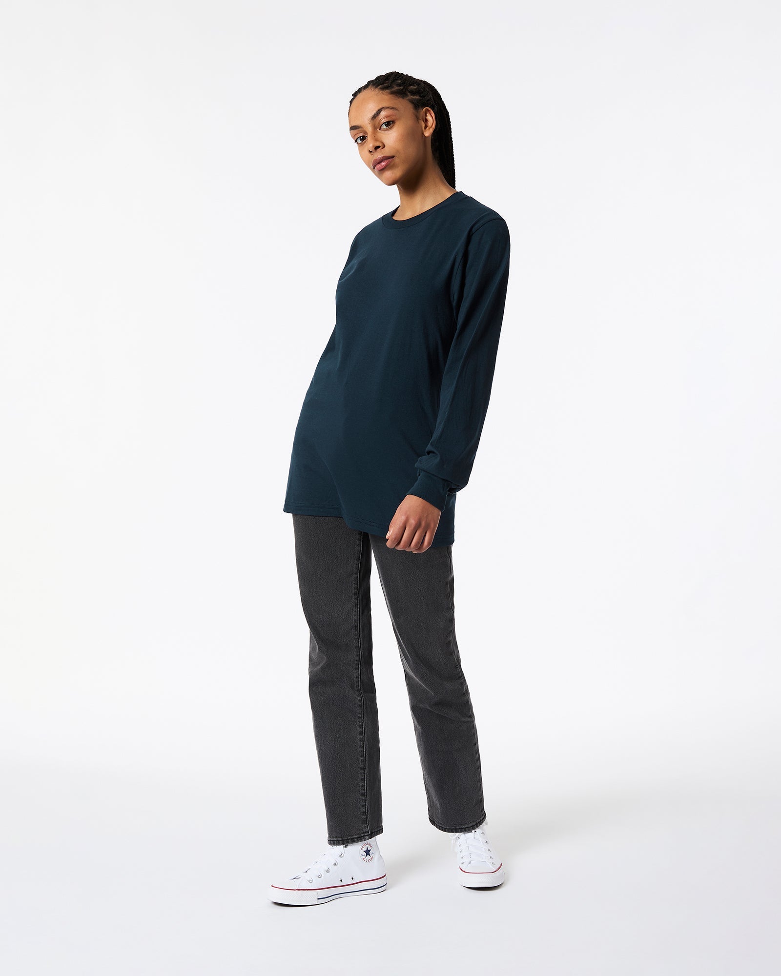 Female model wearing American Apparel Navy Colour Fine Jersey Unisex Long Sleeve Crew Neck Tee (Front pose) -navy