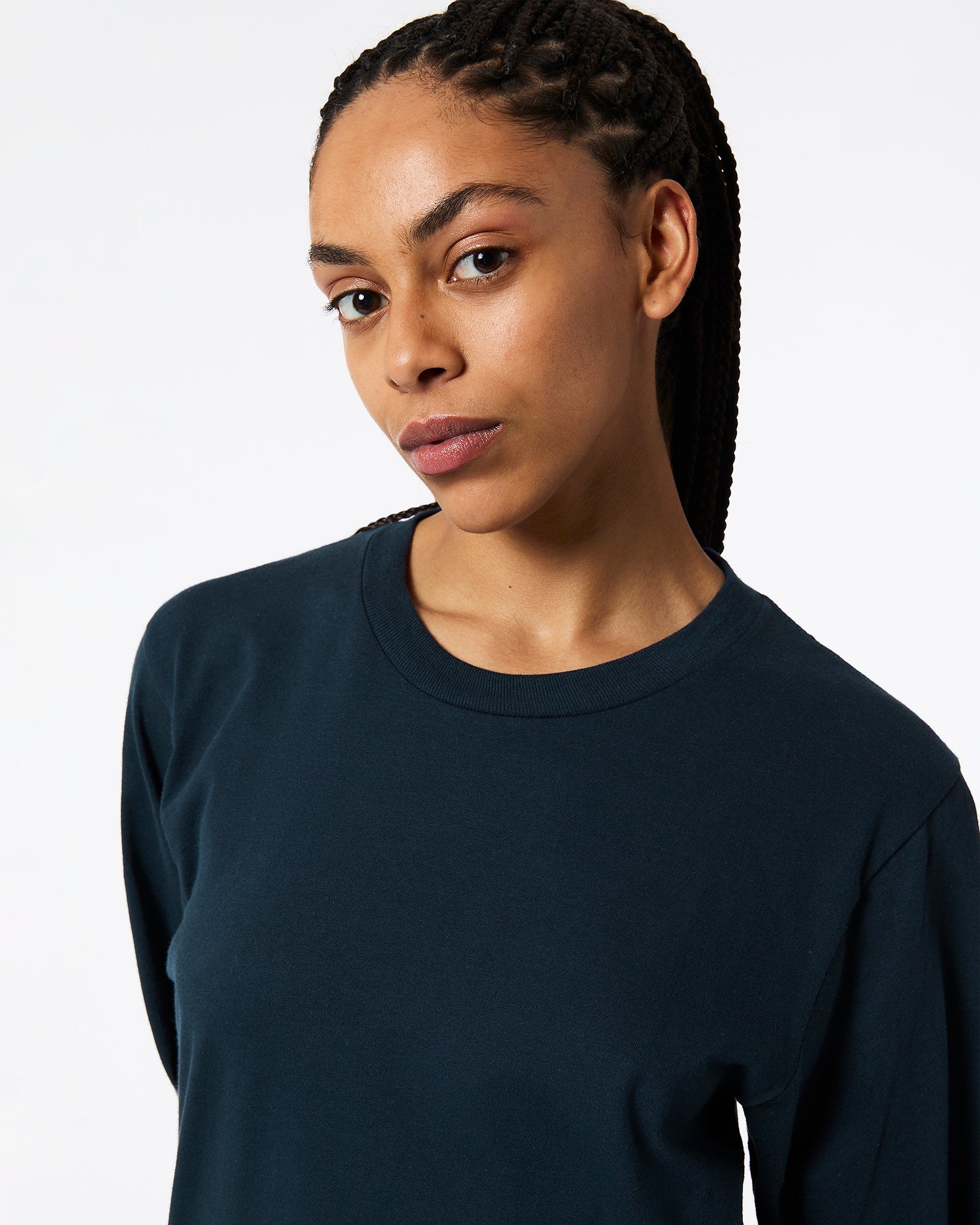 Female model wearing Navy Colour Fine Jersey Unisex Long Sleeve Crew Neck Tee (Half Front pose) navy