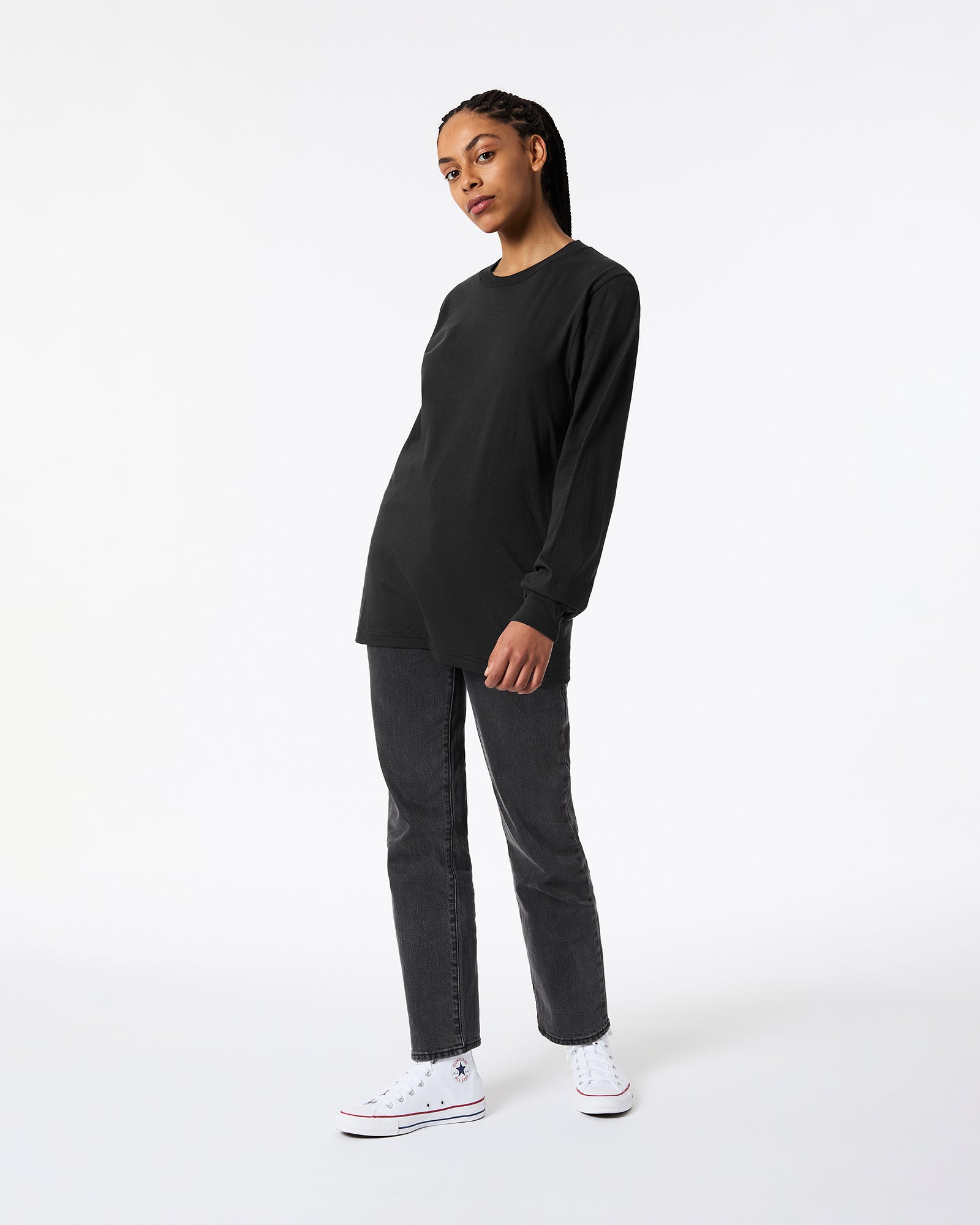Female model wearing Black Colour Fine Jersey Unisex Long Sleeve Crew Neck Tee (Front pose) -black