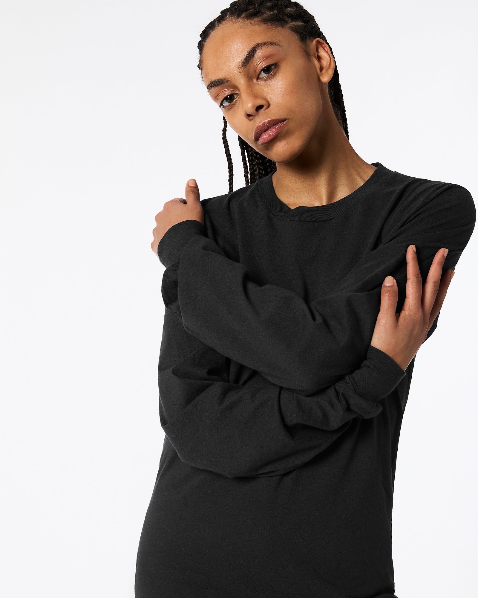 Female model wearing American Apparel Black Colour Fine Jersey Unisex Long Sleeve Crew Neck Tee (Front pose) -black