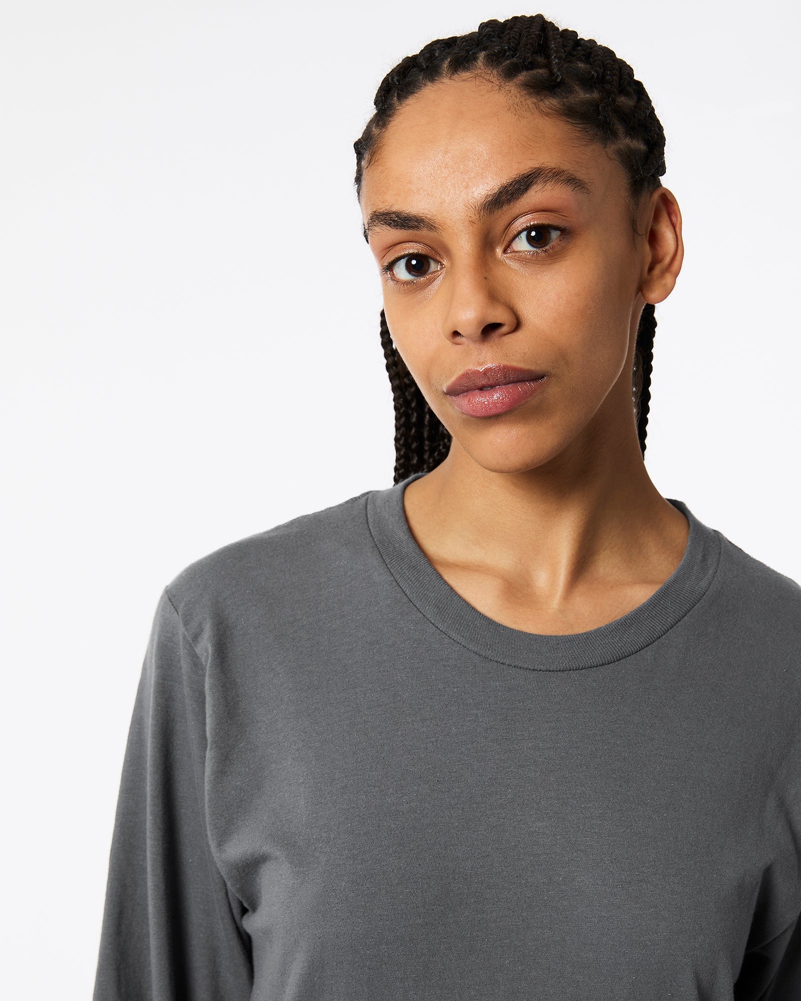 Female model wearing Asphalt Colour Fine Jersey Unisex Long Sleeve Crew Neck Tee (Half Front pose) -asphalt