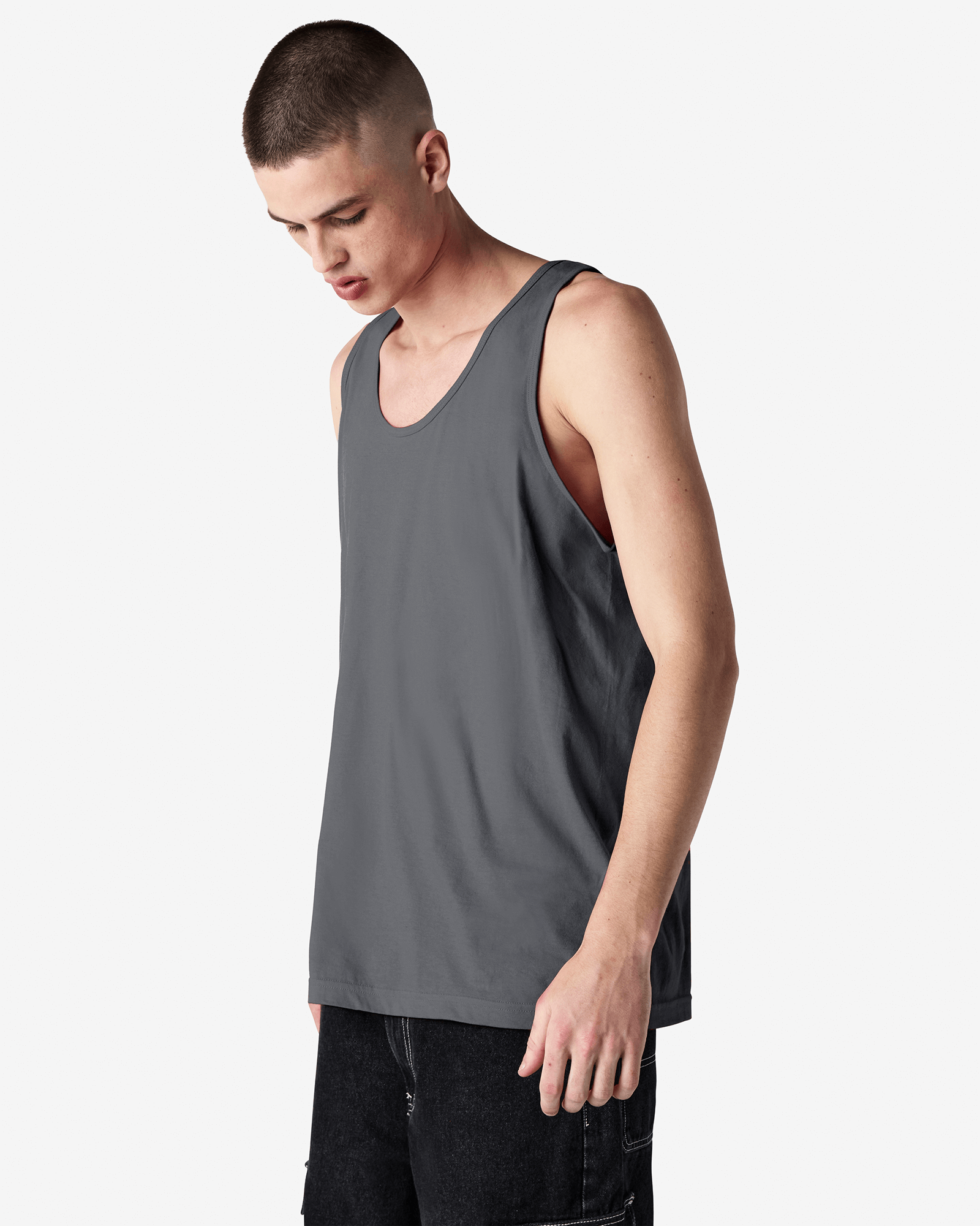 Male model wearing asphalt colour American Apparel Fine Jersey Unisex Tank Top (front pose) -asphalt