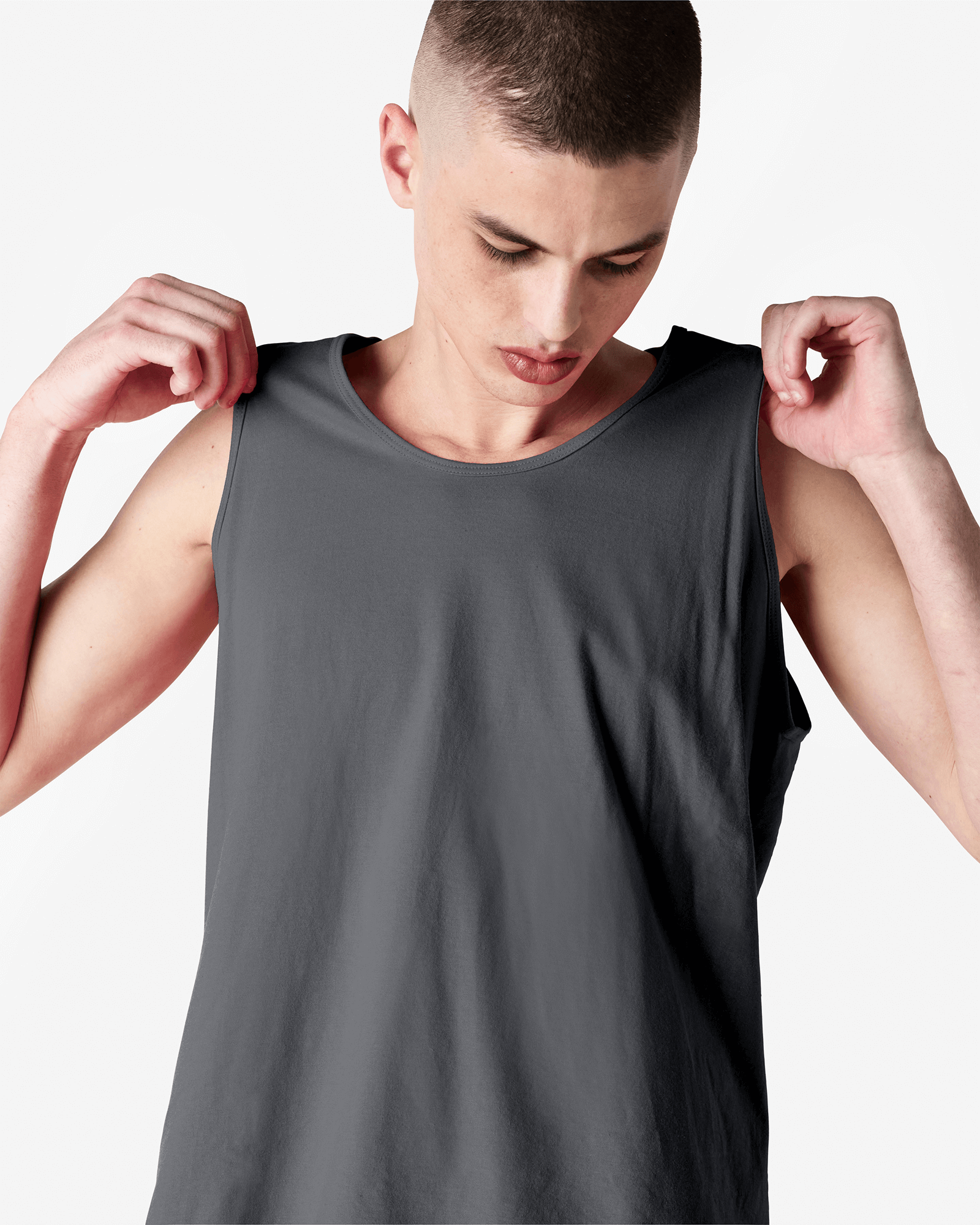 Male model wearing asphalt colour American Apparel Fine Jersey Unisex Tank Top (front pose) -asphalt