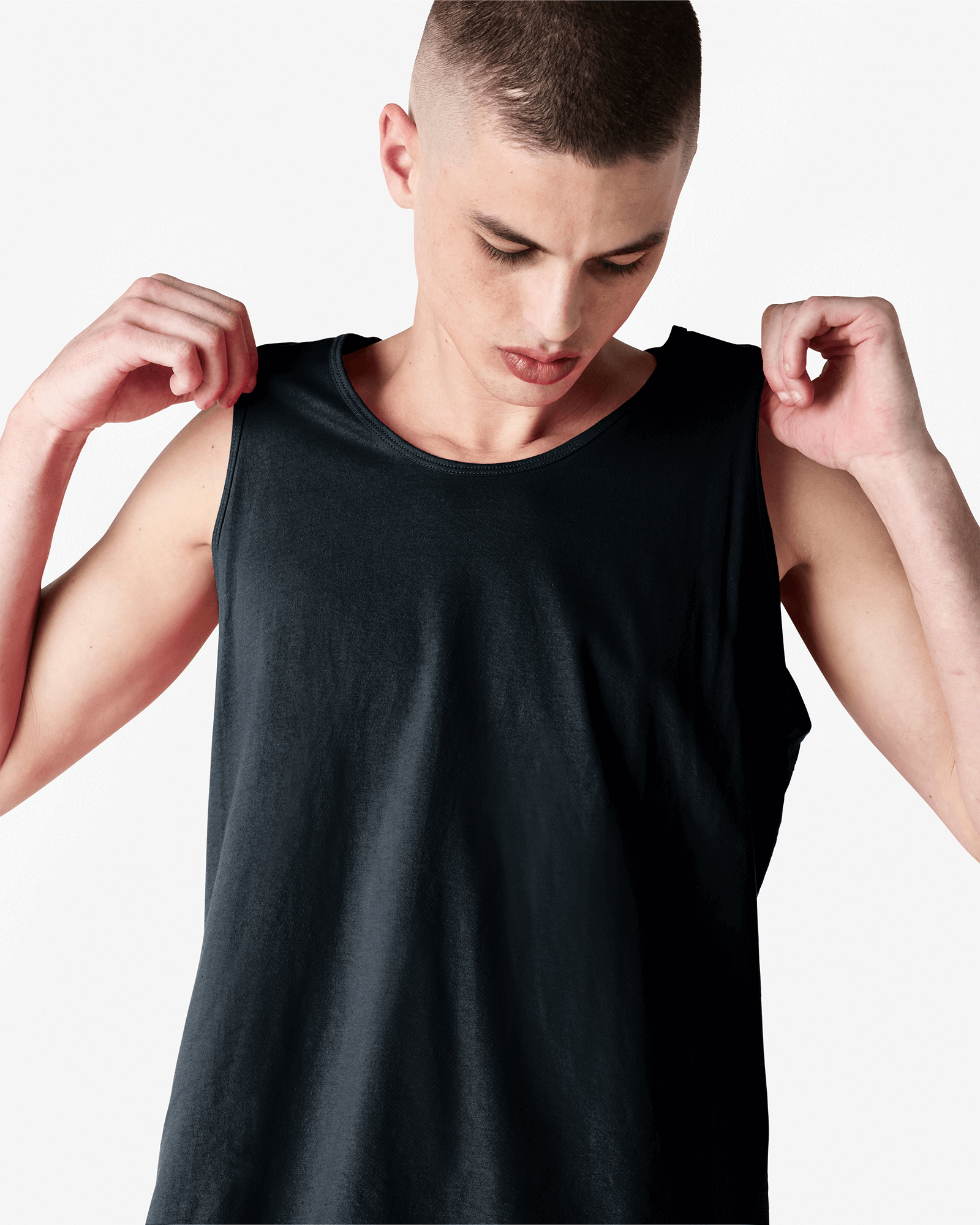 Male model wearing black colour American Apparel Fine Jersey Unisex Tank Top (front pose) -black