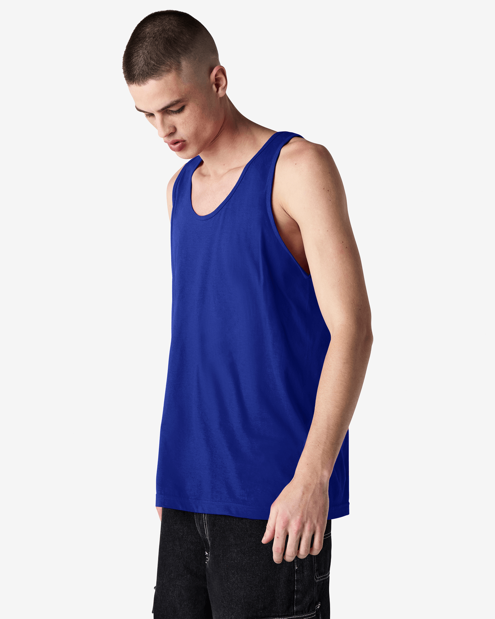 Male model wearing lapis colour American Apparel Fine Jersey Unisex Tank Top (side pose) -lapis
