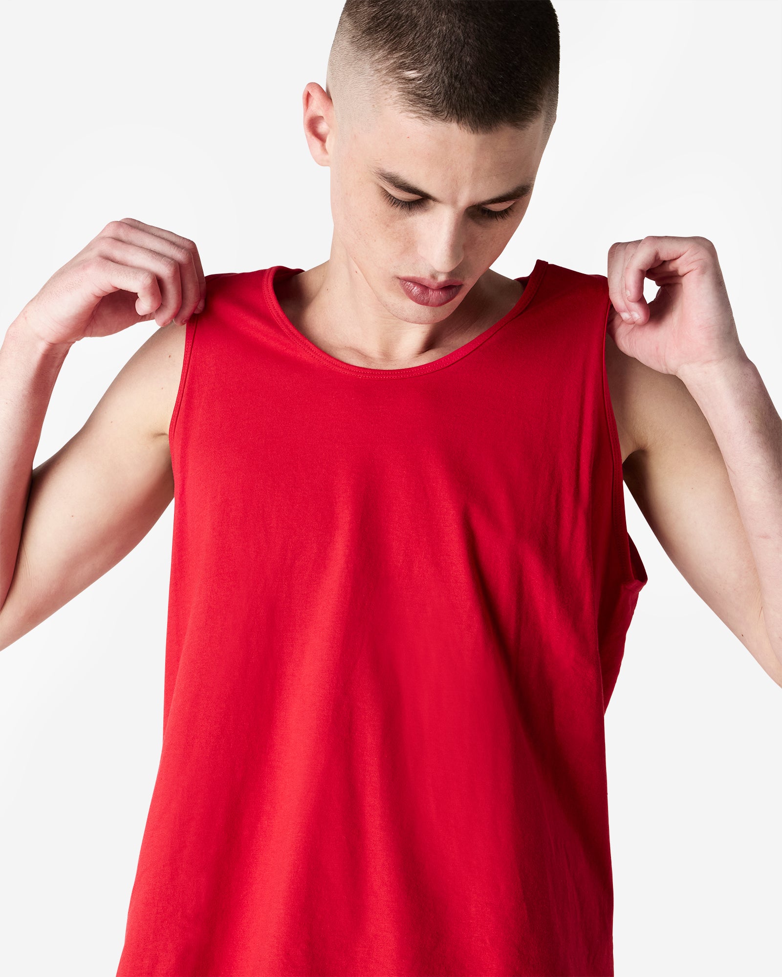 Male model wearing red colour American Apparel Fine Jersey Unisex Tank Top (front pose) -red