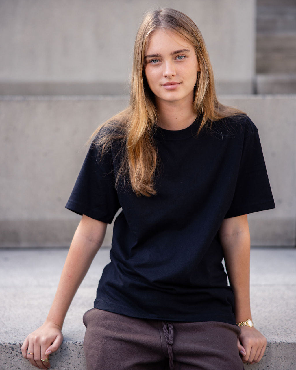 Female model wearing an American Apparel 9001 Unisex Oversized Fit Super Heavyweight T-shirt - Black