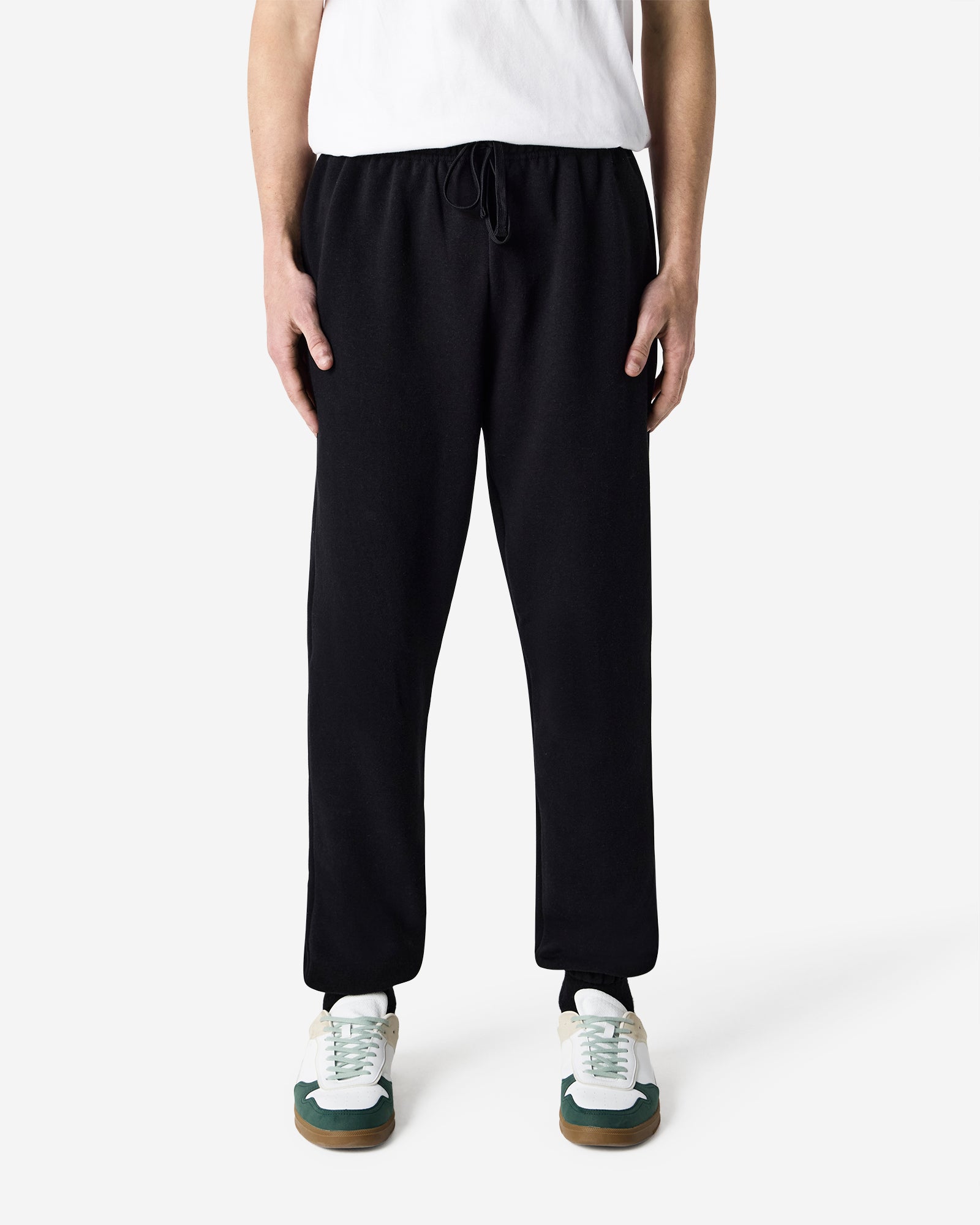 Male model wearing American Apparel Blush Sweatpants (front pose) -black