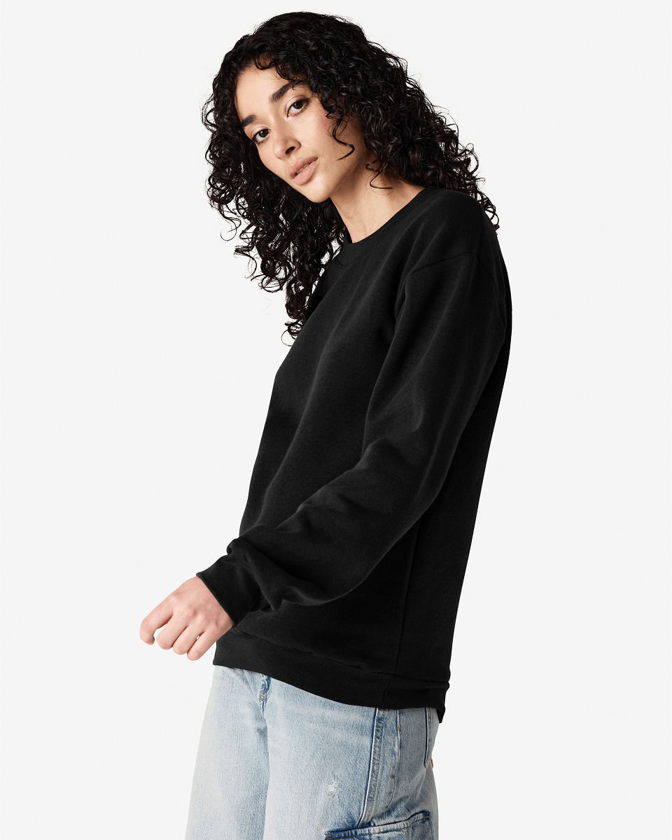 Female model wearing a Reflex Unisex Crewneck Sweatshirt (side pose) -black