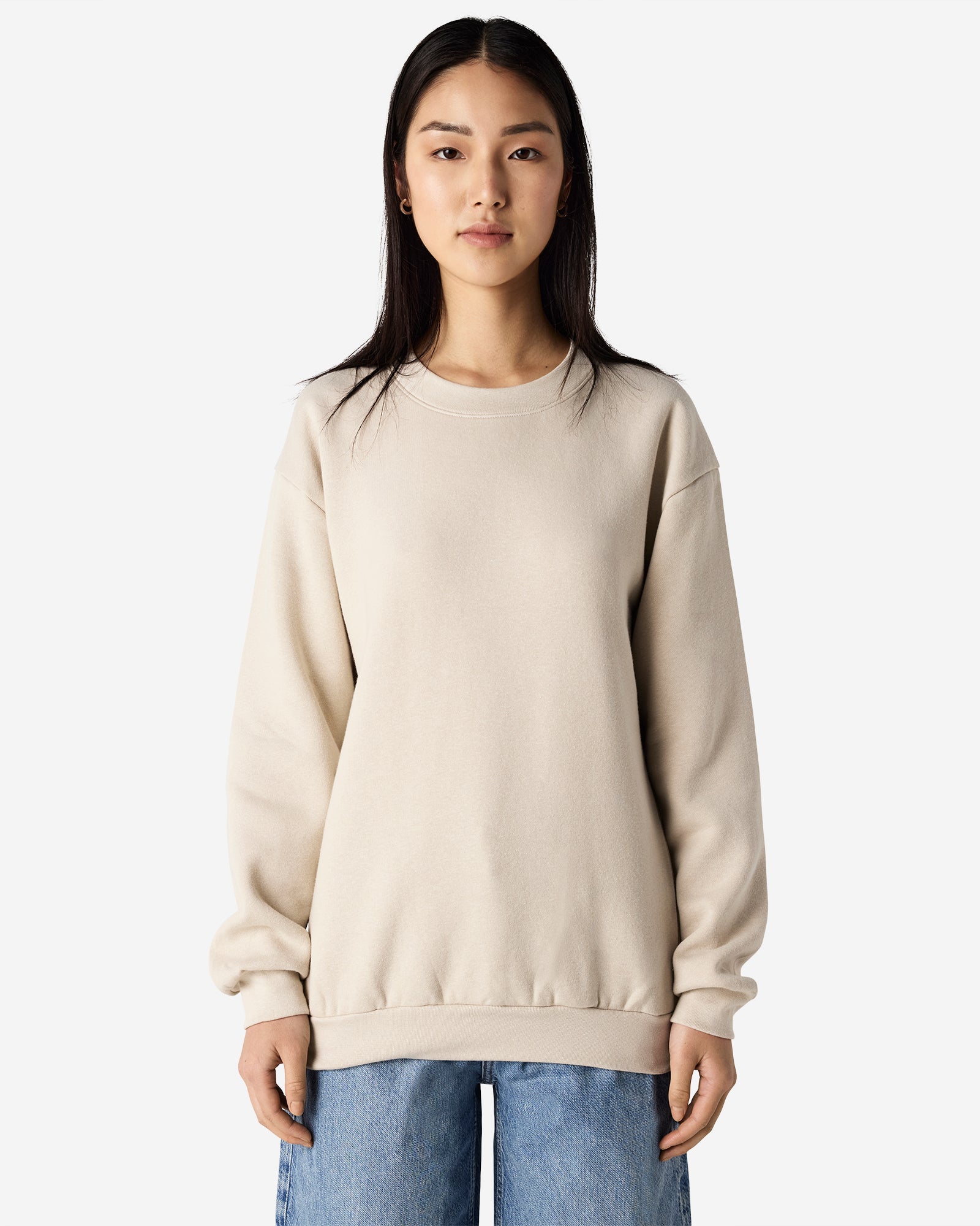 Female model wearing a Reflex Unisex Crewneck Sweatshirt (front pose) -bone