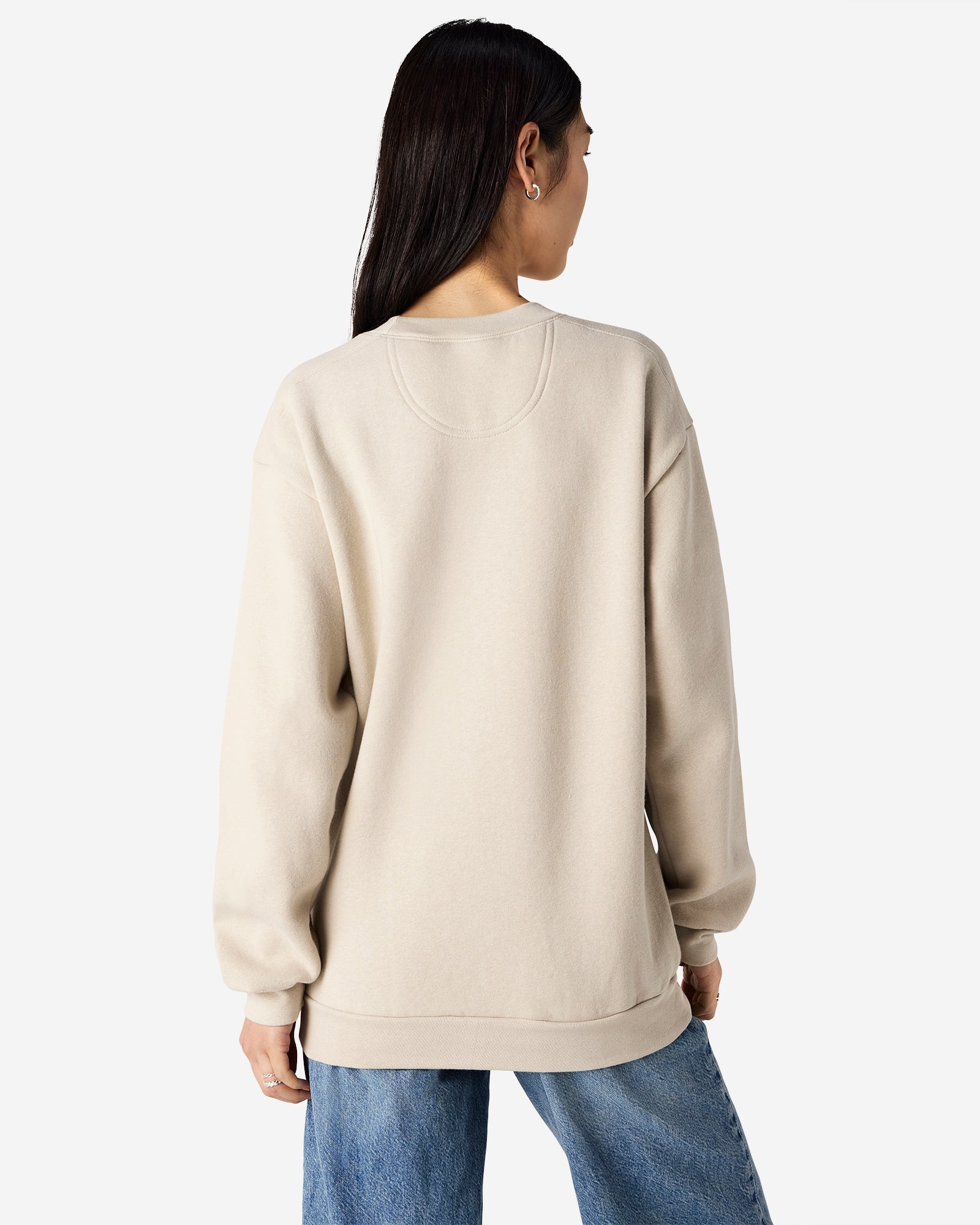 Female model wearing a Reflex Unisex Crewneck Sweatshirt (back pose) -bone